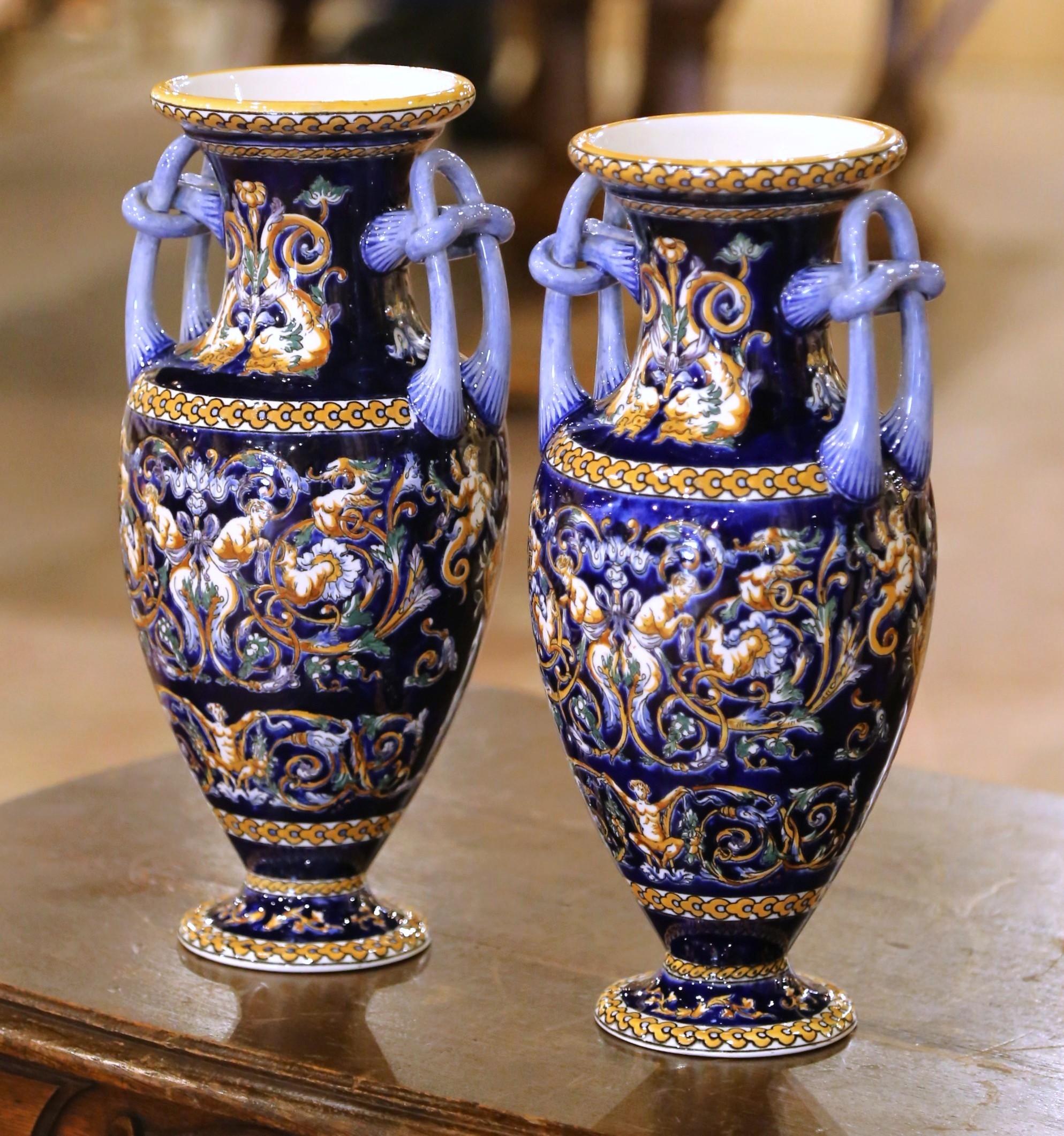 Porcelain Pair of Early 20th C. Faience Vases with Hand-Painted Cherub Motifs from Gien For Sale