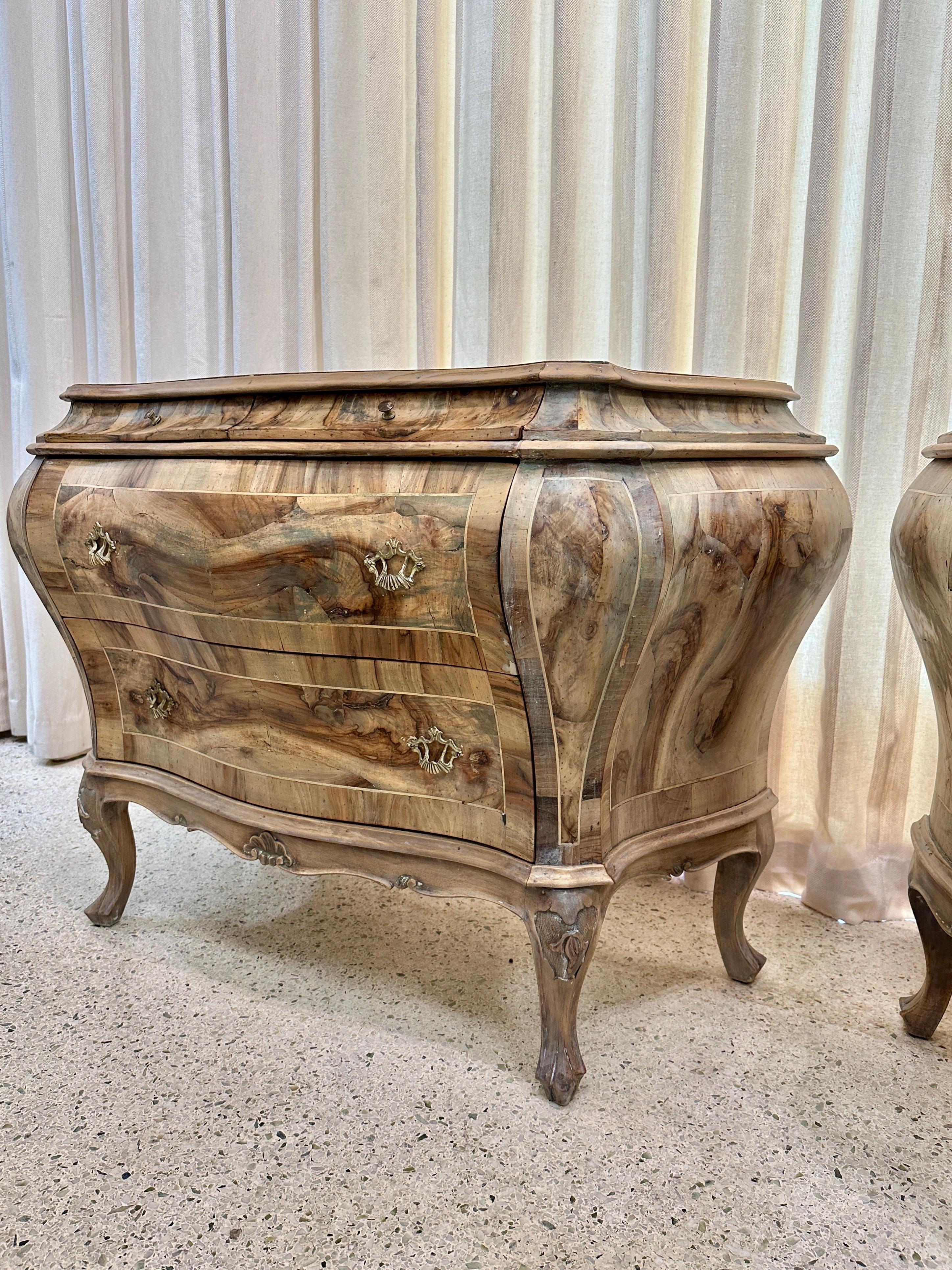 These rare olive wood veneer patchwork commodes in a waxed natural finish, provide ample storage with two large bottom drawers and 2 smaller upper drawers.  The olive wood has been stripped and waxed which highlights the natural beauty of the wood