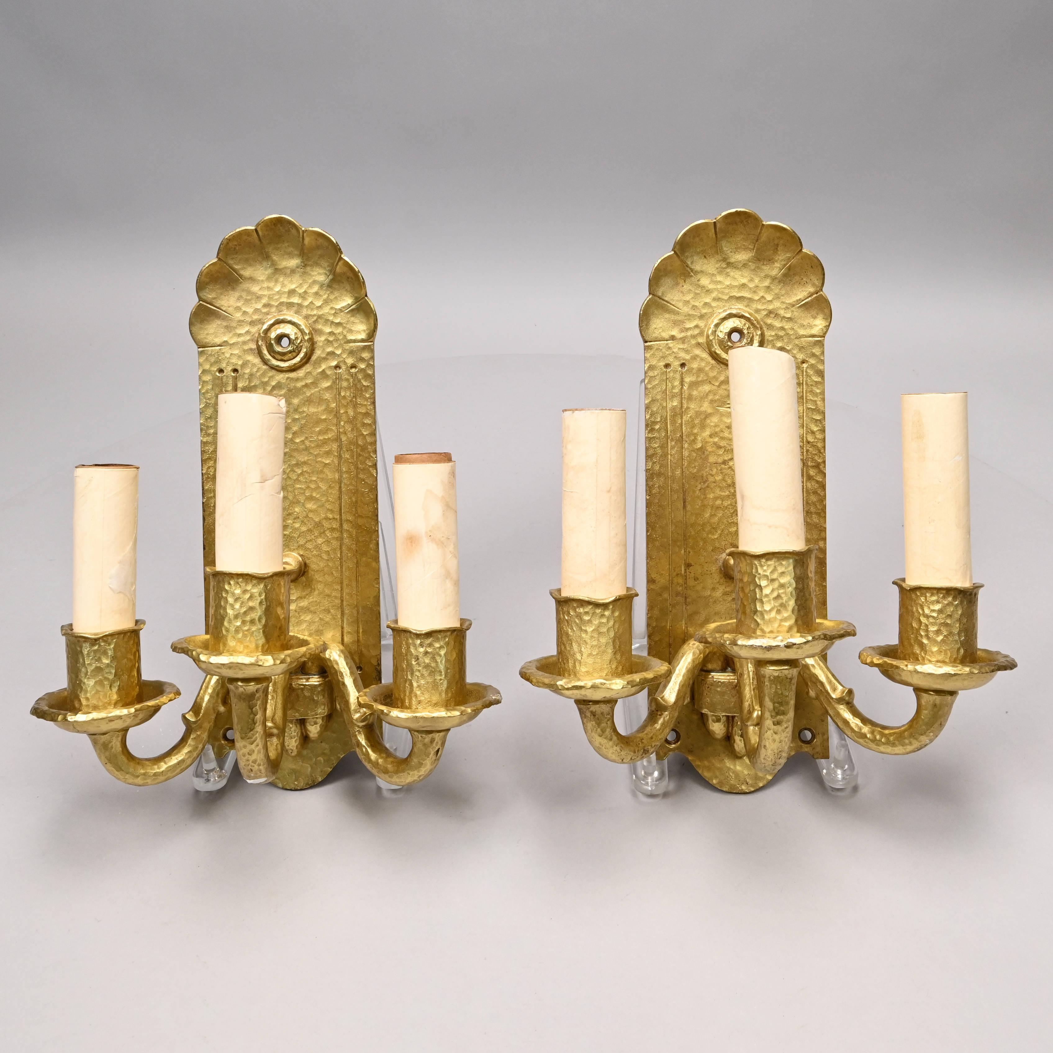 Anonymous
Early 20th cent.; probably American
Gilt metal

Approximate size: 13 (h) x 9.75 (w) x 6.75 (d) in.

A vintage pair of Art Nouveau or Art Deco 3-light wall sconces in gilt metal.  These distinctive sconces are exquisitely realized with a