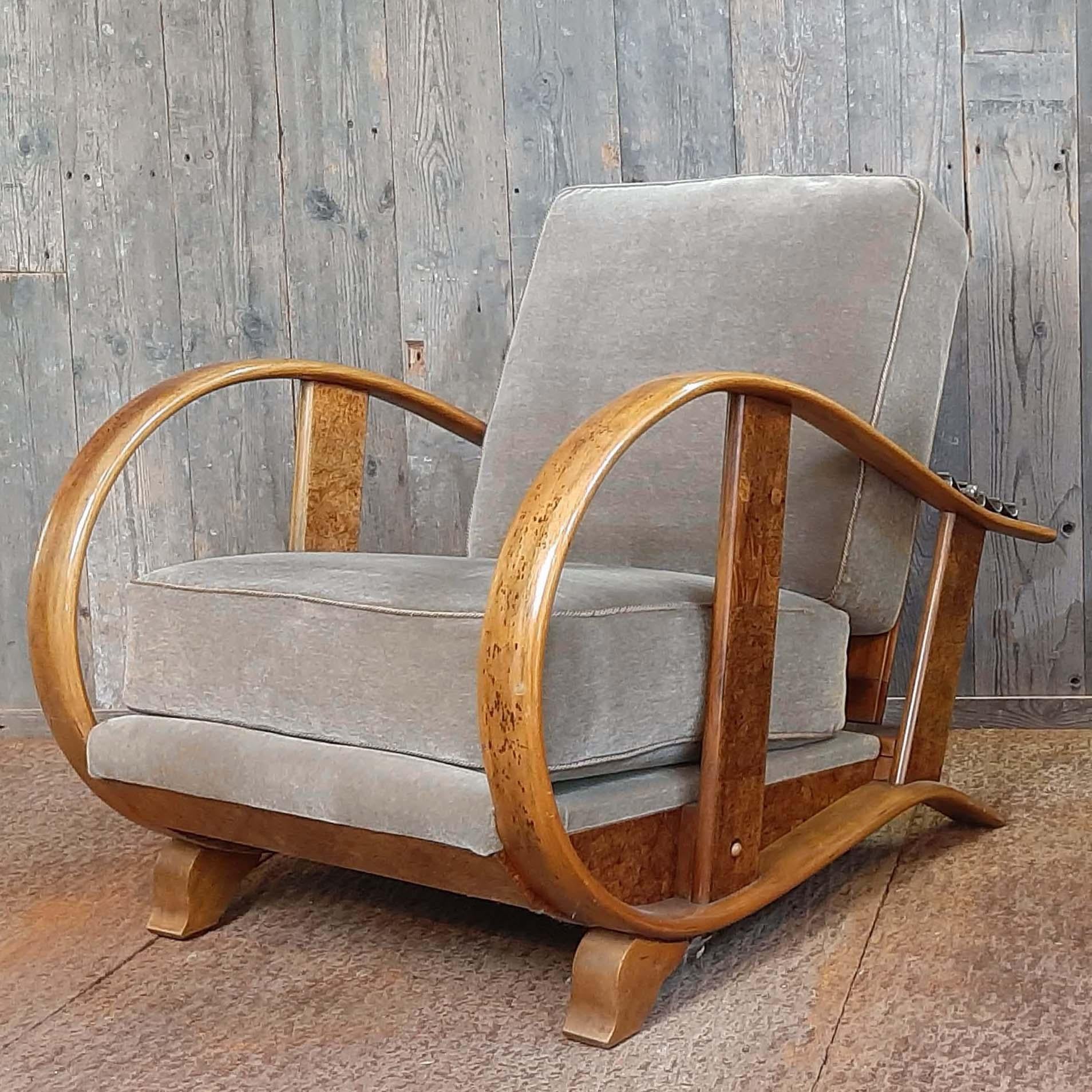 Pair of early 20th century Art Deco lounge chairs, in beech and fabric, by Jindrich Halabala, Czech Republic, 1930s. 

This extraordinary pair of Halabala chairs have a very dynamic appearance. Beautifully curved armrests in beech nicely blend
