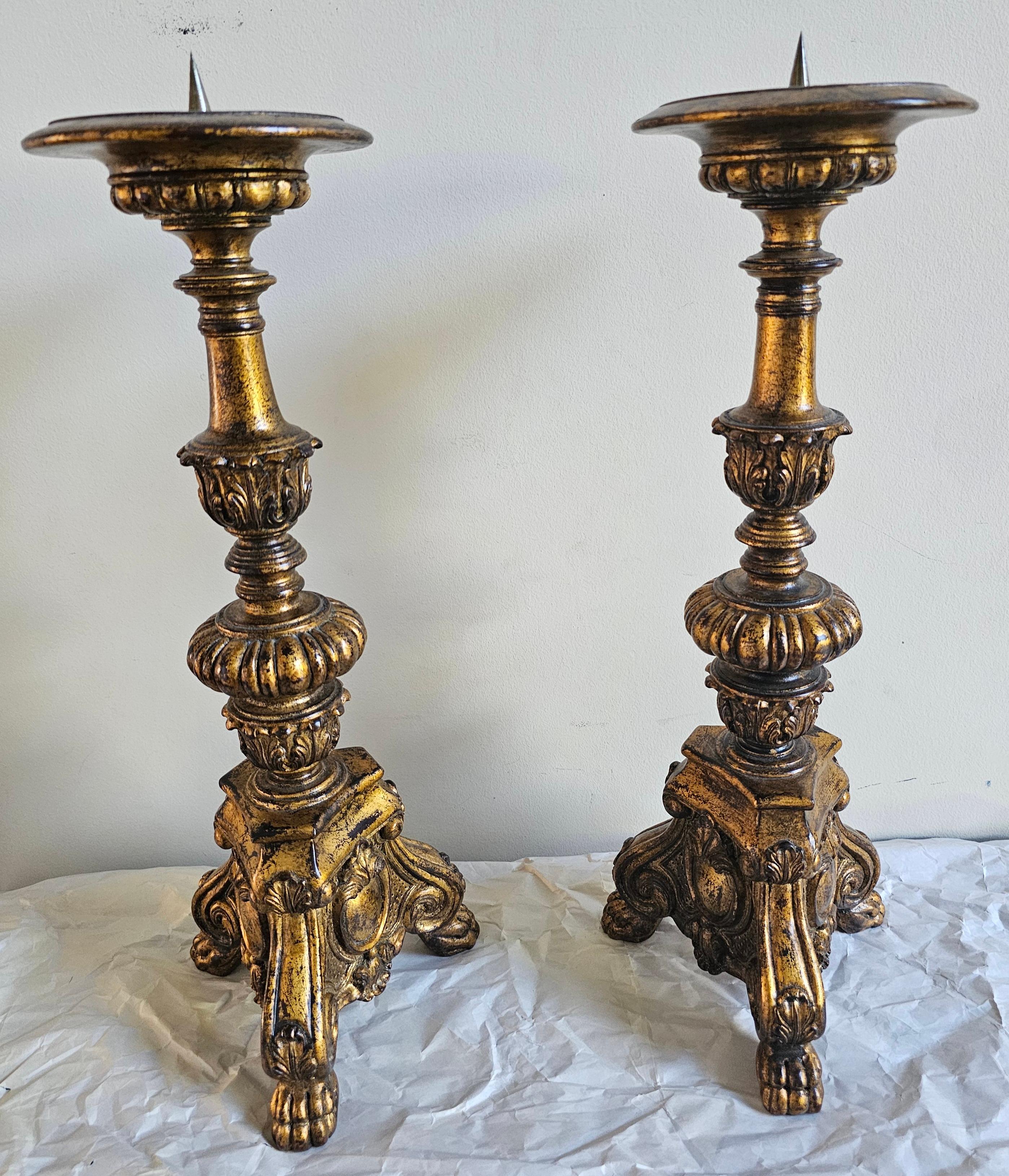 An exquisite Pair of Early 20th Century Baroque Style GiltWood Paw Feet Candlestands with paw trifid. Measure 21.5