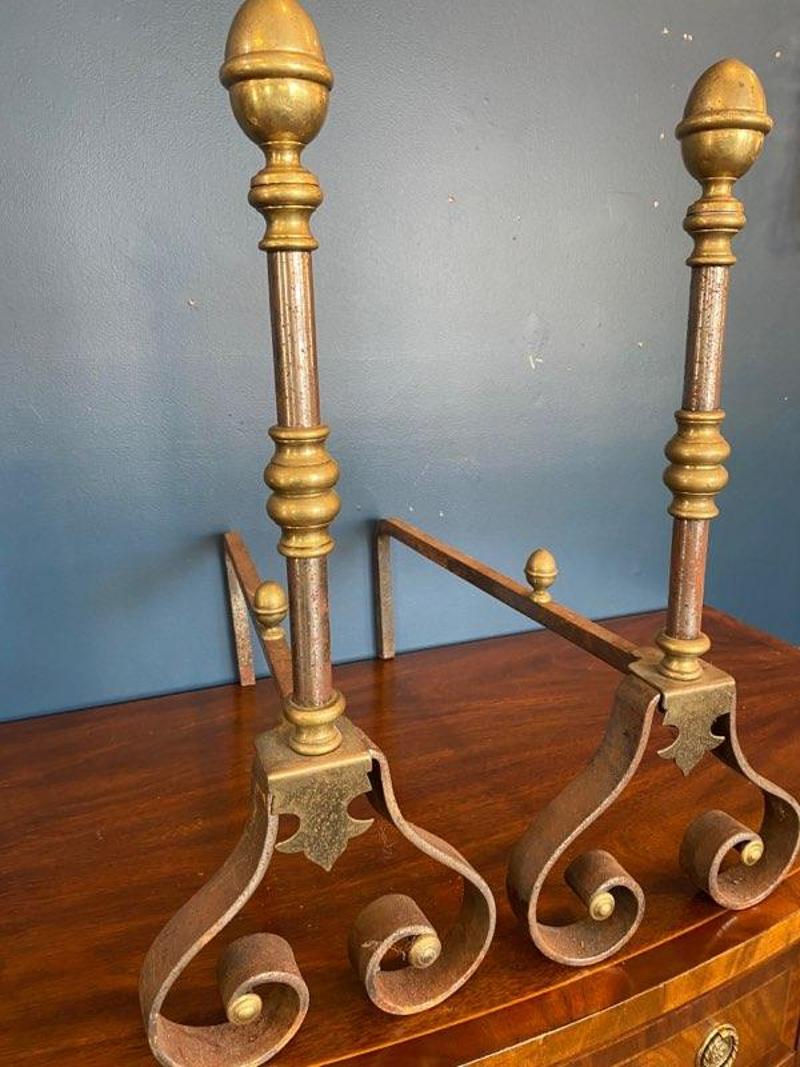 Pair of early 20th century brass and iron andirons with scrolled feet.
Measure: 23