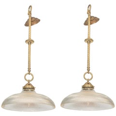 Pair of Early 20th Century Brass Pendants with Holophane Glass Shades