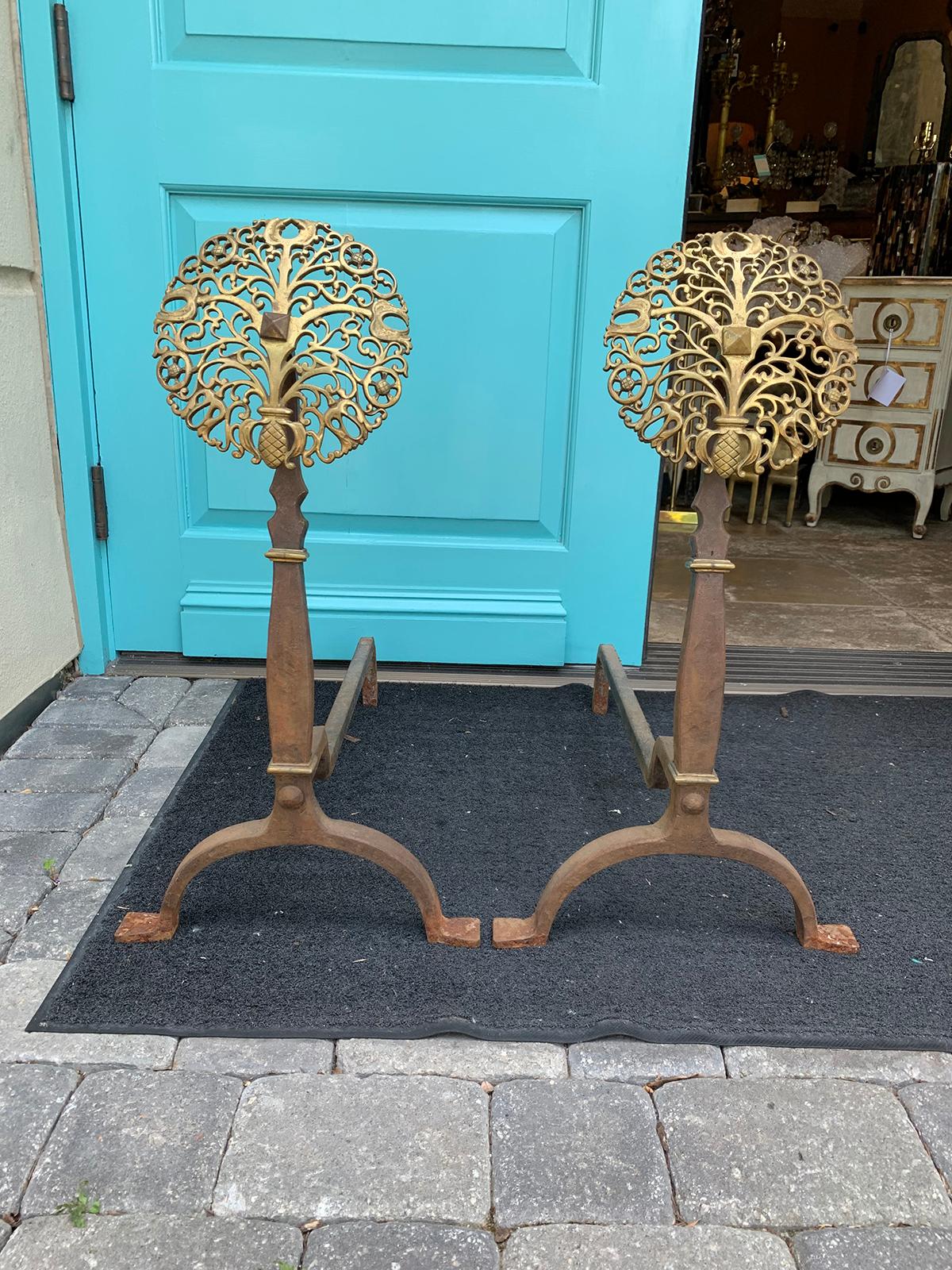 Pair of early 20th century brass and steel medallion andirons, circa 1900.