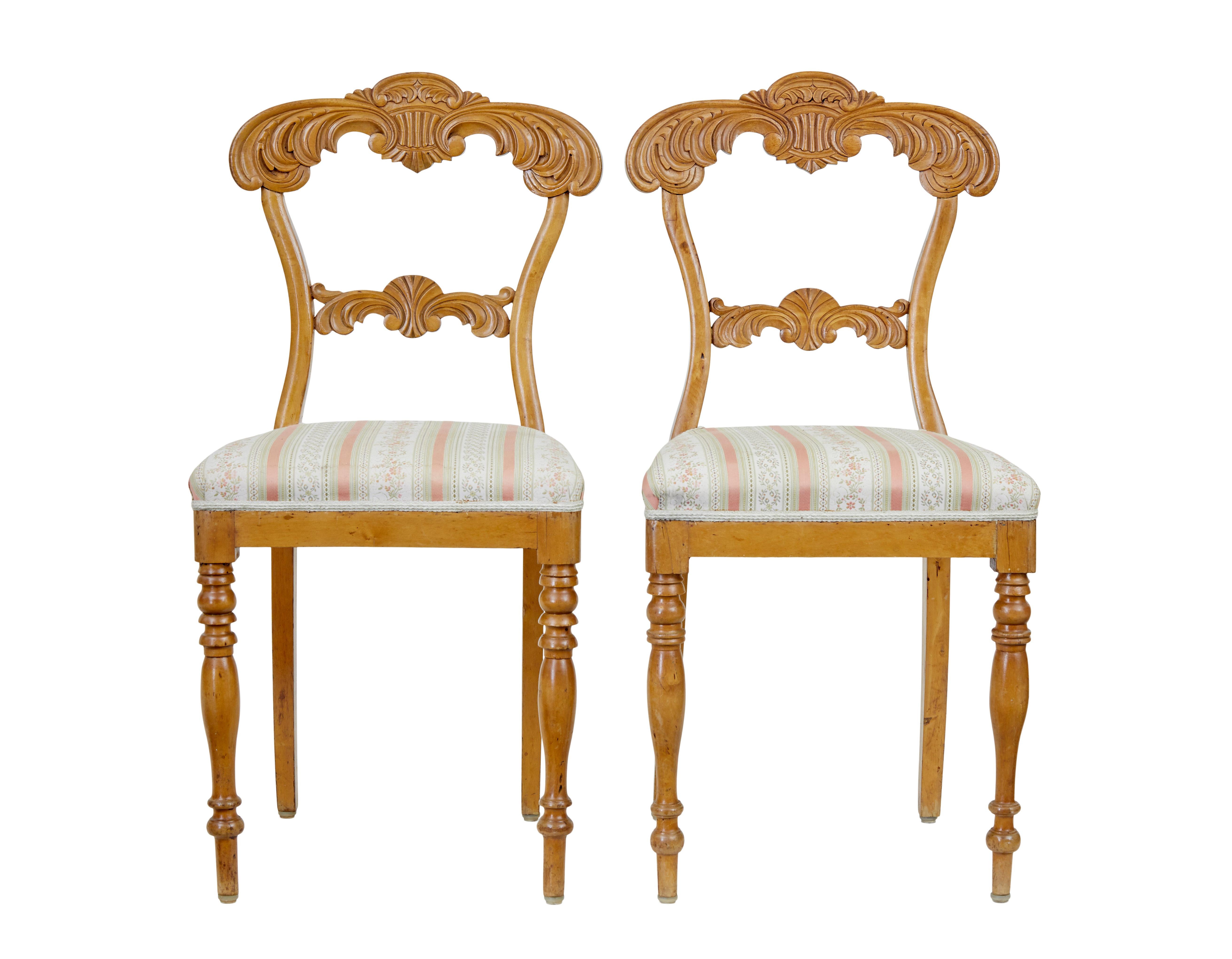 Pair of carved Swedish birch occasional chairs circa 1920,

Heavily carved back rest with scrolls and acanthus leaves. Standing on turned front legs.

Very minor marks to upholstery and restorations to woodwork.

Seat height: 19