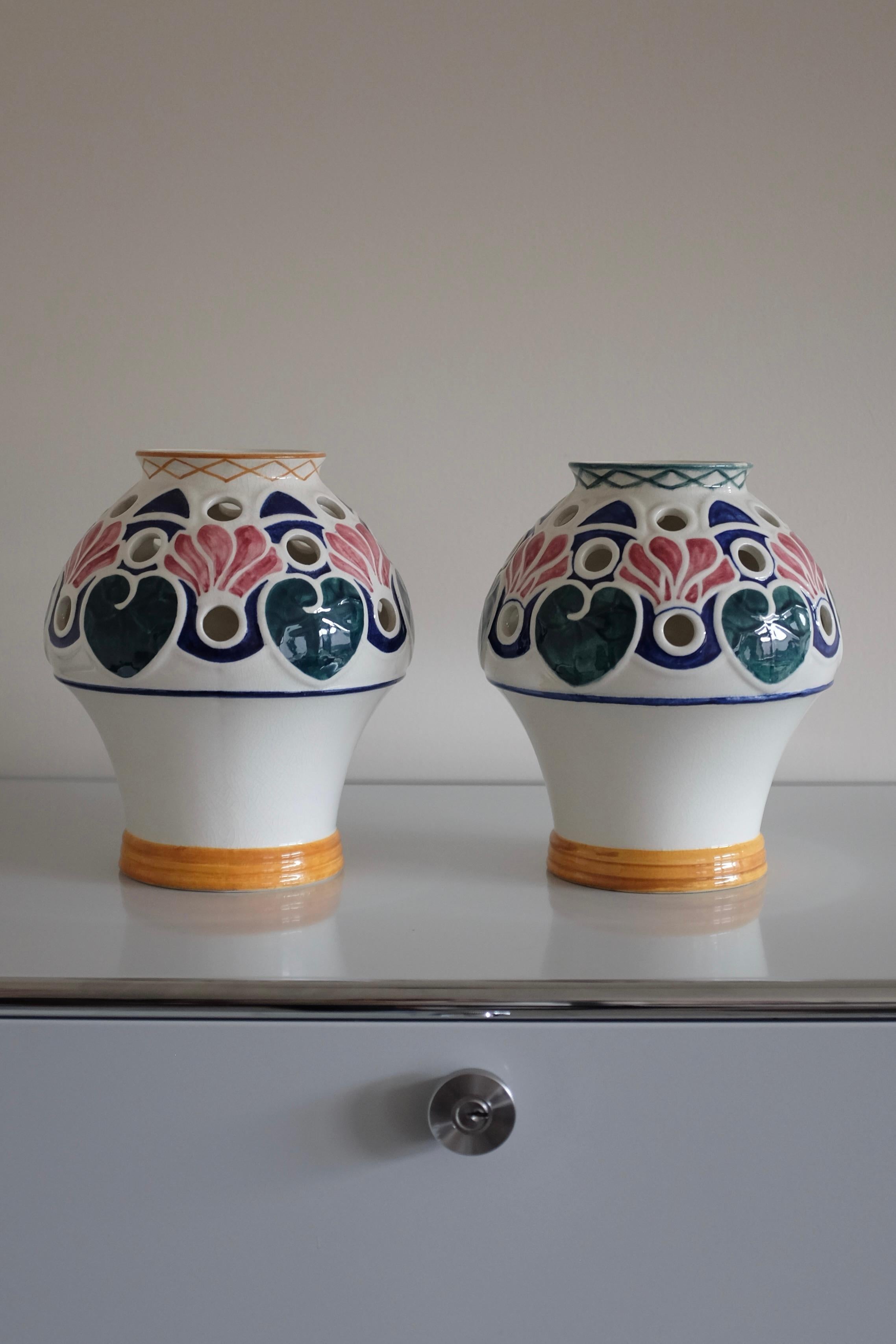 Stunning and rare set of early 20th Century Vases by the Swedish designer Alf Wallander for Rörstrand. As with many of Alf Wallanders ceramic pieces these vases have a art nouveau inspired flower design in green, blue, pinks and yellow colors. Small