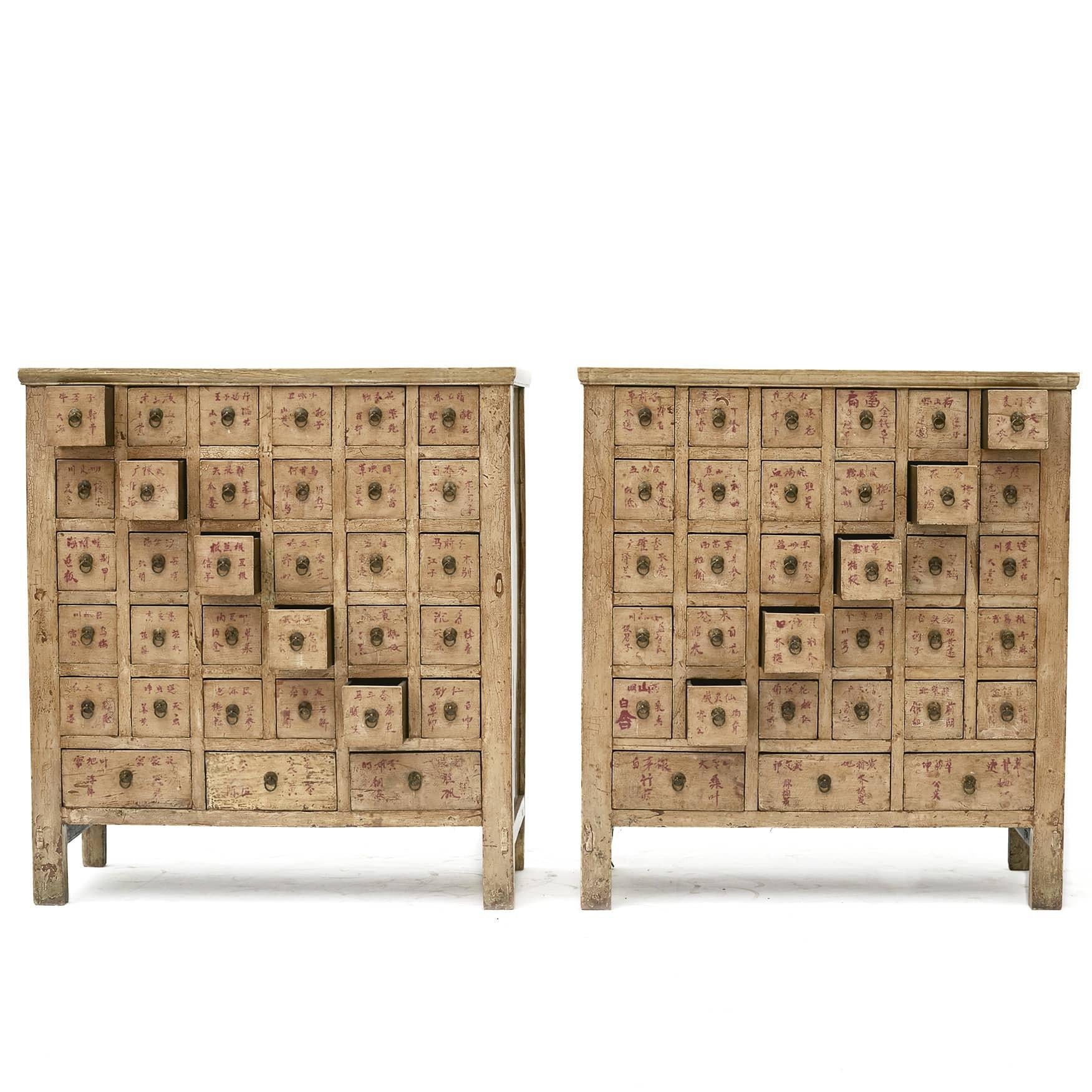Pair of Chinese apothecary / pharmacy medicine chests. Made of elm wood with ivory lacquer.
Each with 33 drawers (30 small square drawers + 3 larger ).
These were used to store and organise Chinese herbs and the drawers were labeled according to the