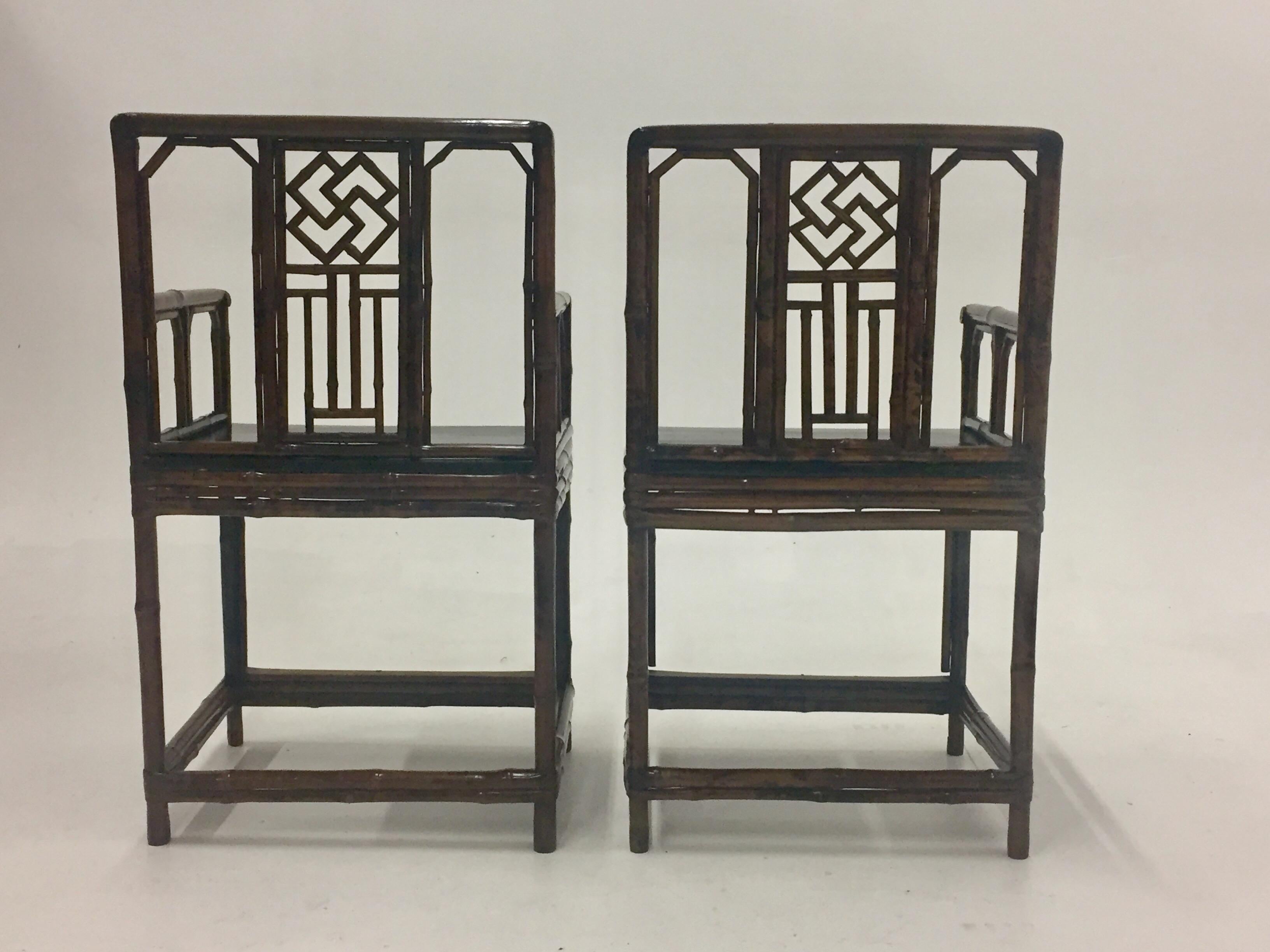 An impressive pair of Asian armchairs having a faux tortoise finish with a lacquered black seat.
Measures: Arm height 28
seat height 20.