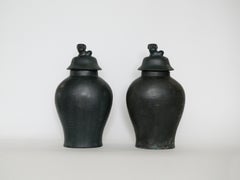 Pair of Early 20th Century Chinese Bronze Urns with Lids
