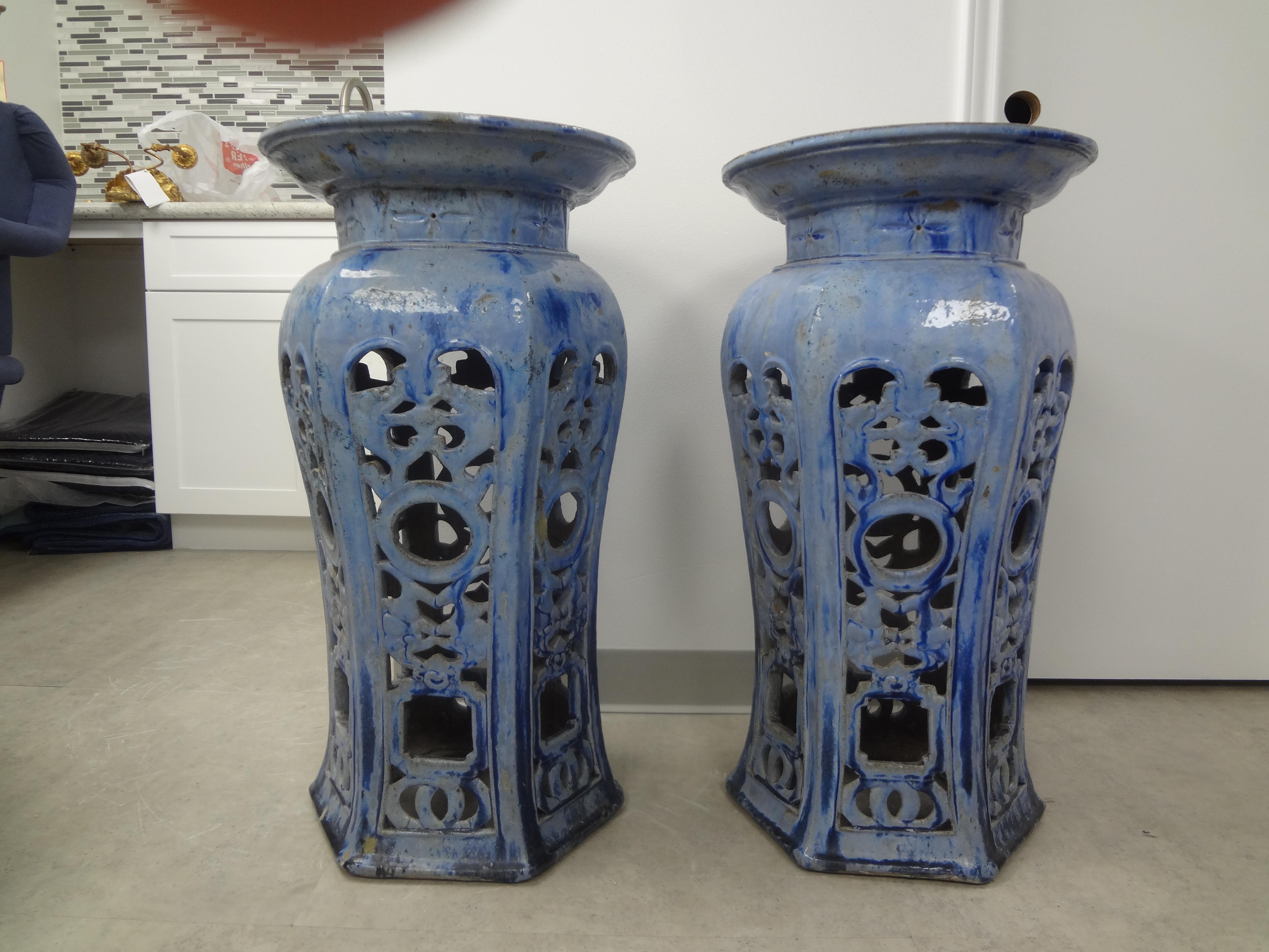 Pair of early 20th century Chinese glazed terra cotta pedestals or stands. These stunning antique Chinese pedestals are executed in an interesting cornflower blue and are perfect for displaying your prized urns or jardinieres. Although antique, this