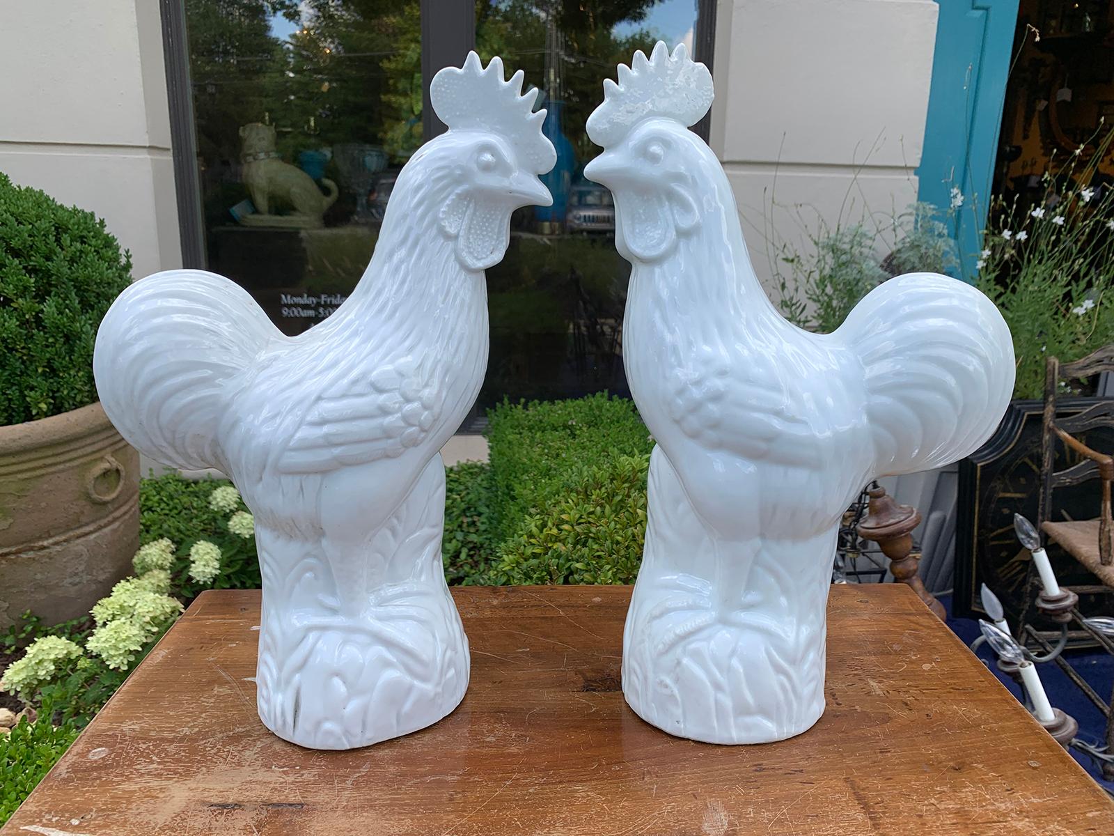 Pair of early 20th century Chinese white porcelain roosters, marked.