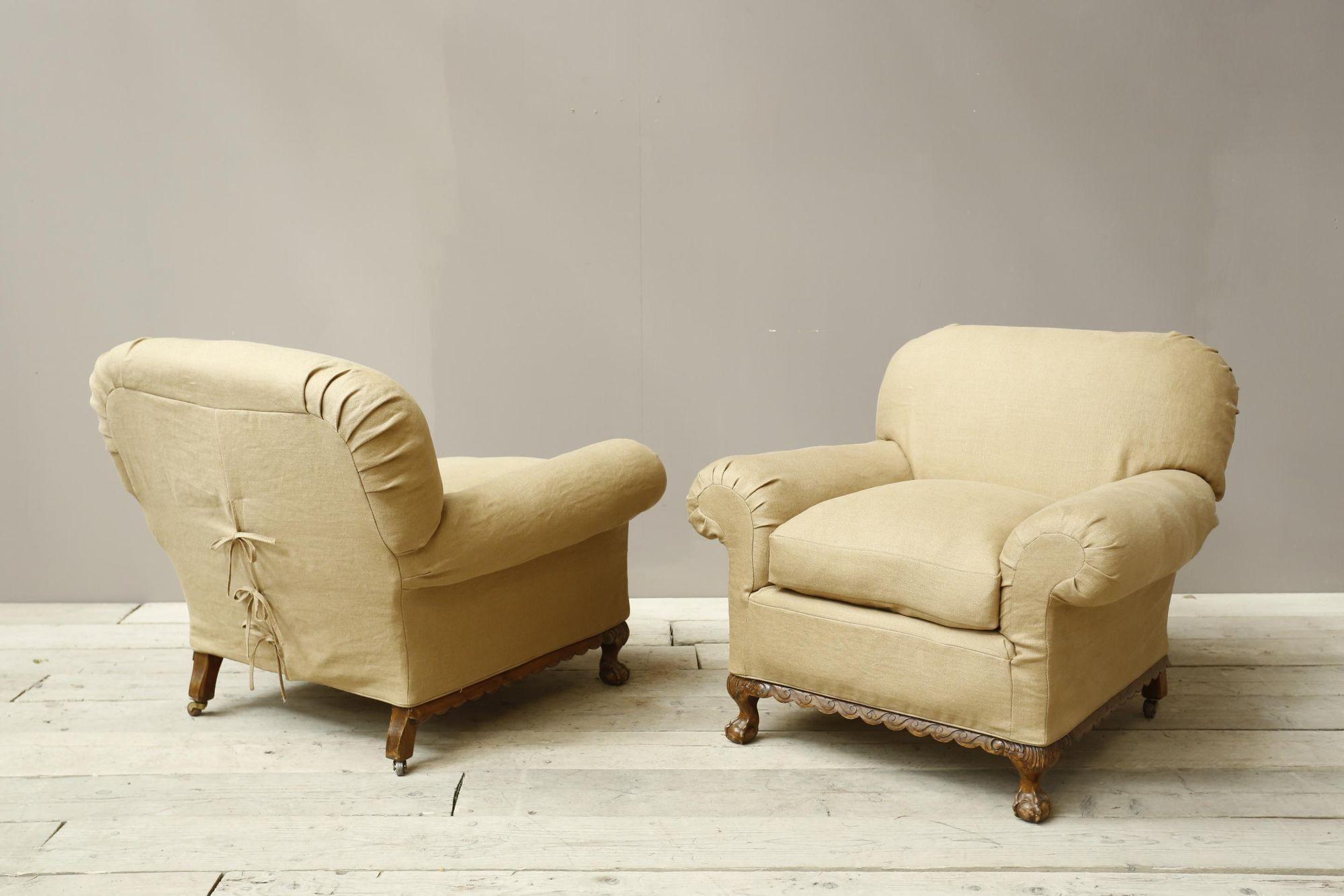 These are a very nice quality pair of Early 20th century Ball and claw country house armchairs. The size of them is superb and makes them hugely comfortable. We have chosen to upholster them in a 100% natural Linen slip cover with a tied back which