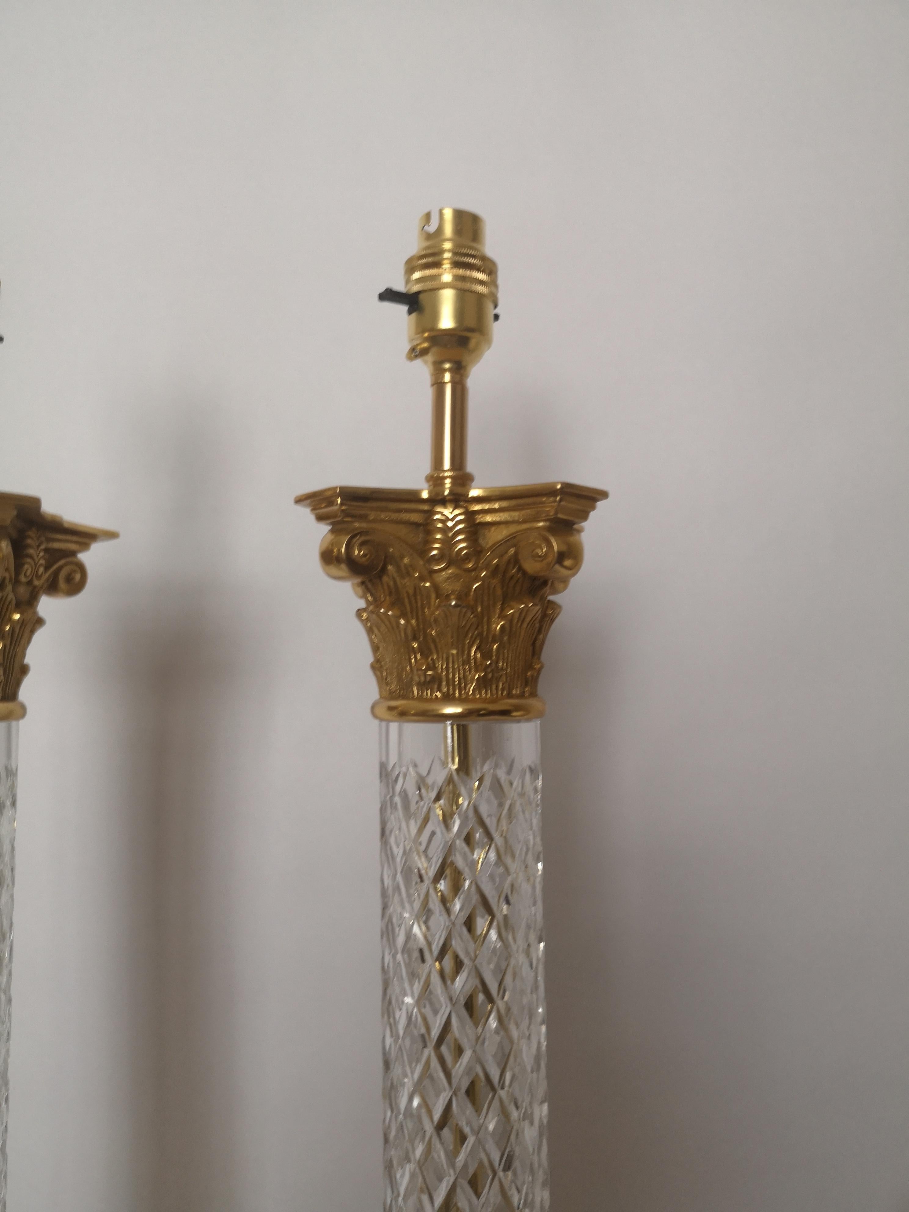 A pair of early 20th century French lamps, the diamond pattern cut crystals stems topped with gilt bronze capitals and standing on gilt bronze bases.
Recently Re Wired and PAT tested.
French, circa 1940s.