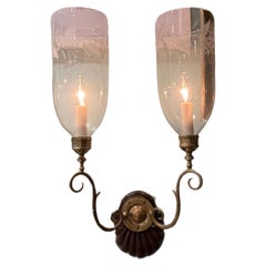 Pair of early 20th century double arm hurricane shade sconces