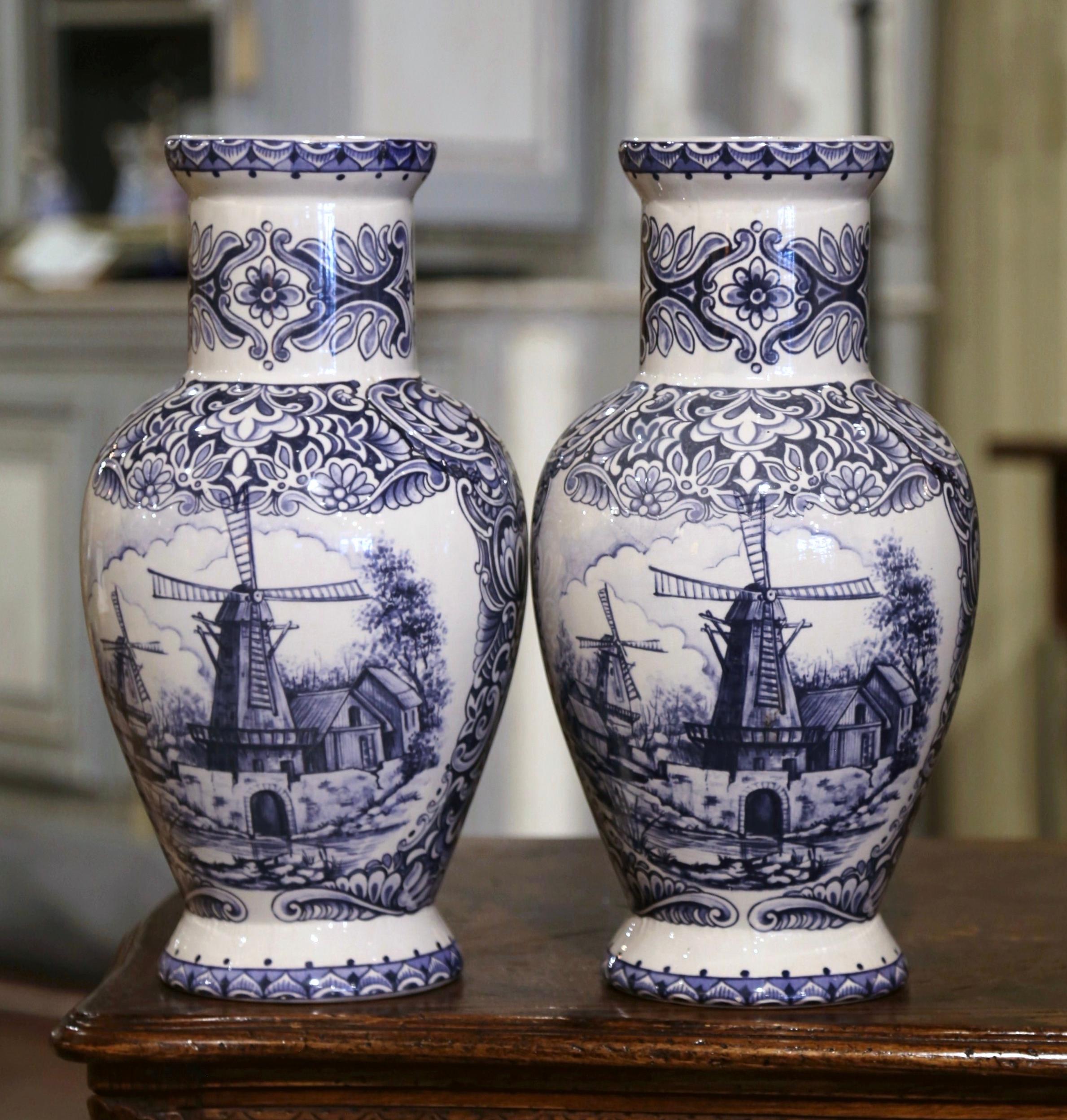 Ceramic Pair of Early 20th Century Dutch Blue and White Hand Painted Faience Delft Vases For Sale