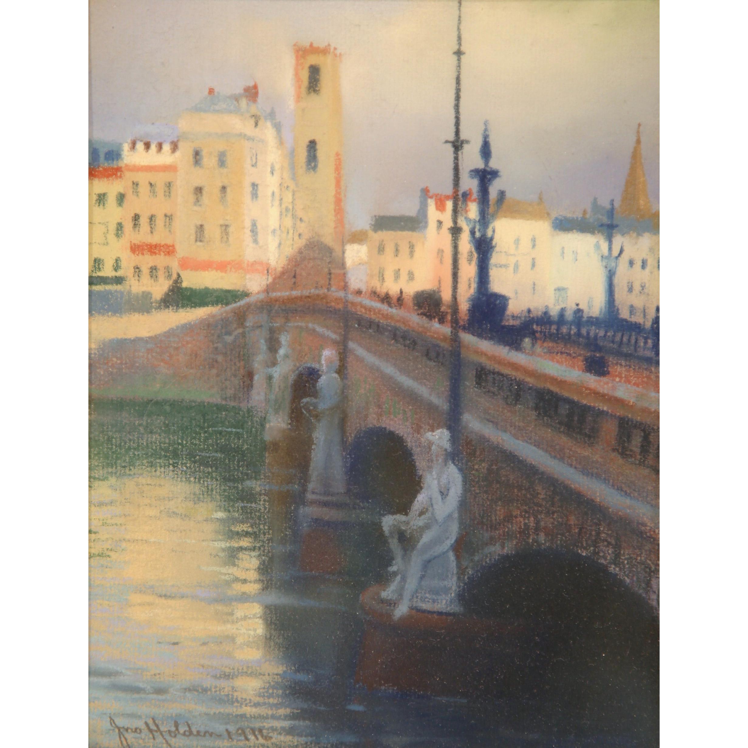 This fine pair of antique watercolors was painted in England, and is signed and dated Holden, 1916. The compositions show two cityscapes situated on a river. The color palette is soft and neutral, and the pieces are covered with clear glass. The