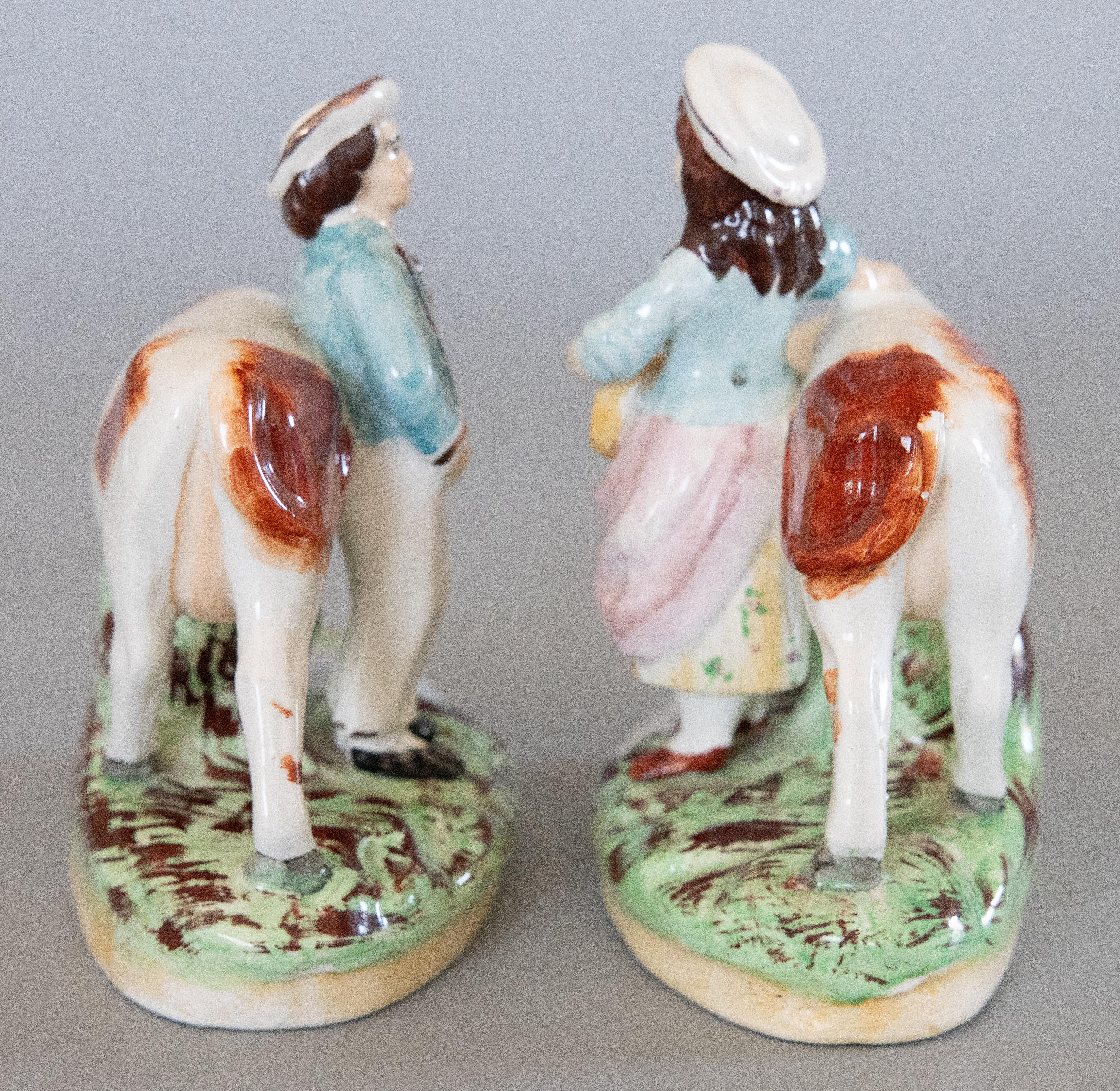 Pair of Early 20th Century English Staffordshire Boy & Girl Cow Figurines For Sale 1