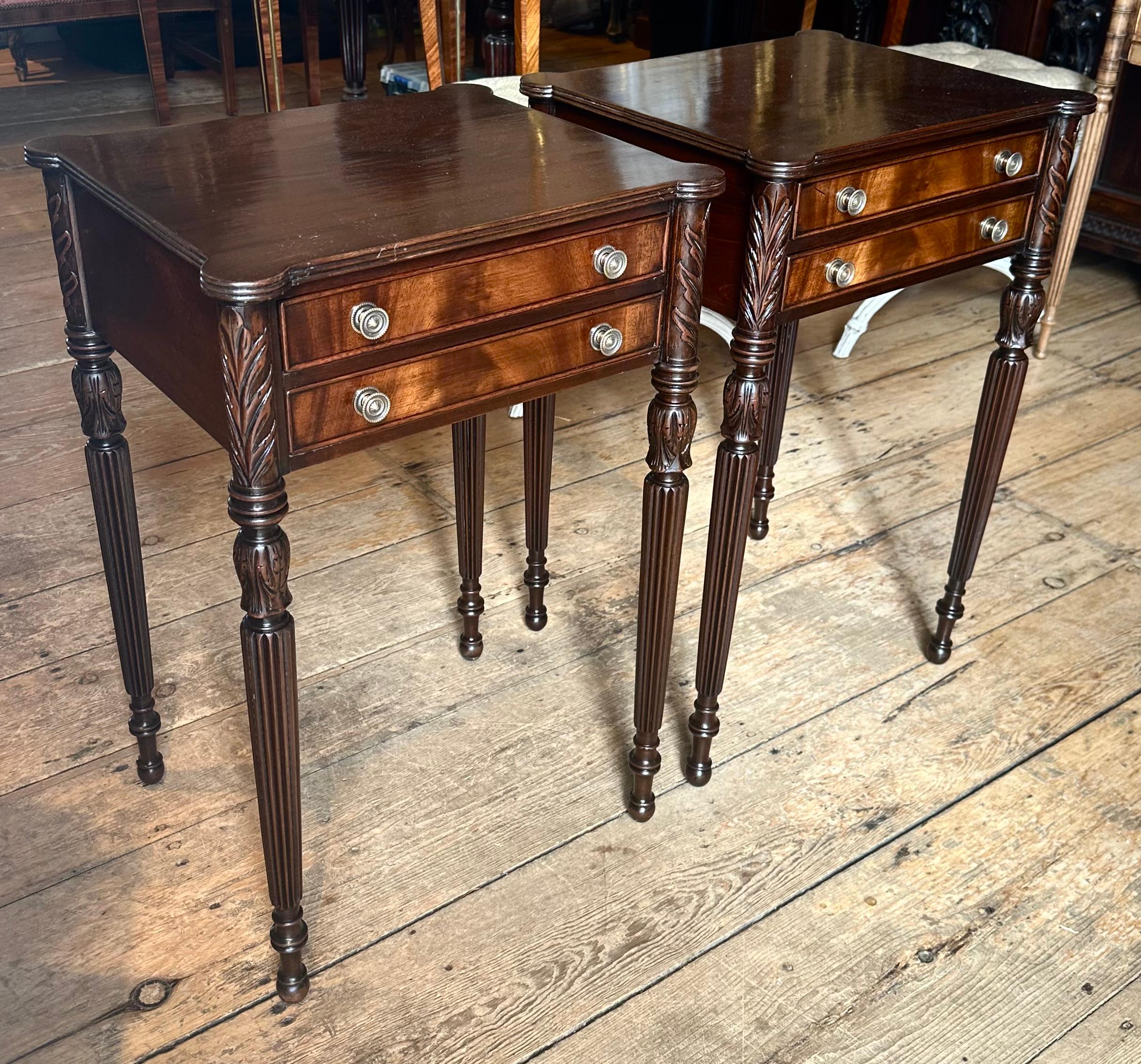 Pair of Federal Style Side or End Tables after Thomas Seymour, Boston.  Hand carved and fluted legs.  Two drawers.  Dovetail construction.  Mahogany and mahogany crotch veneer.  Beautiful custom work probably by Sacks of Boston, Early 20th Century.