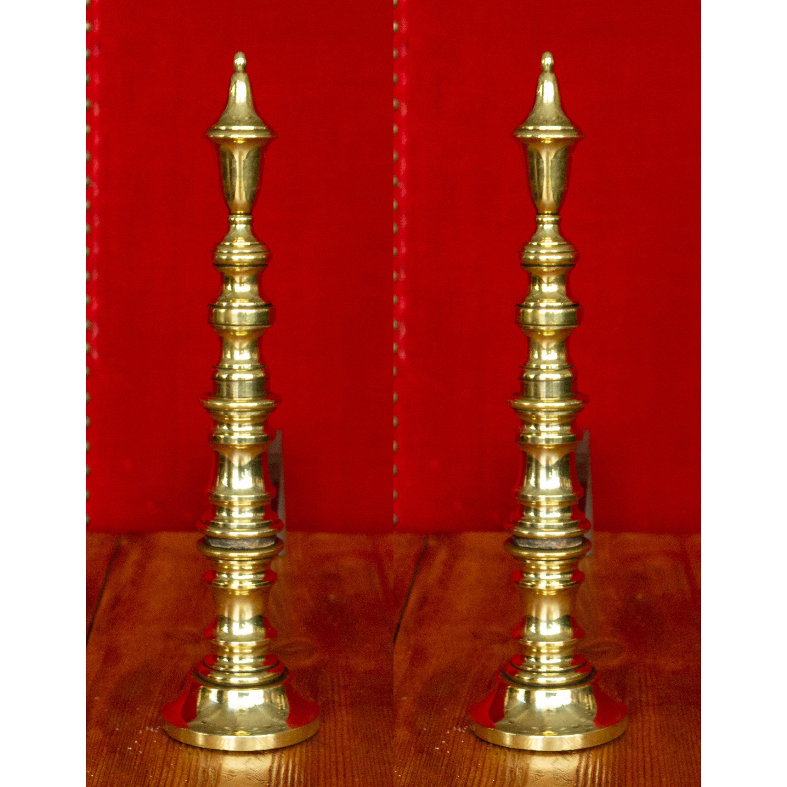 This pair of ornate French brass andirons, circa 1910, are comprised of elegantly stacked turned components. With dimensions of 15 inches high, 3.5 inches wide and 16 inches deep, they are well suited for a variety of fireplaces and their good