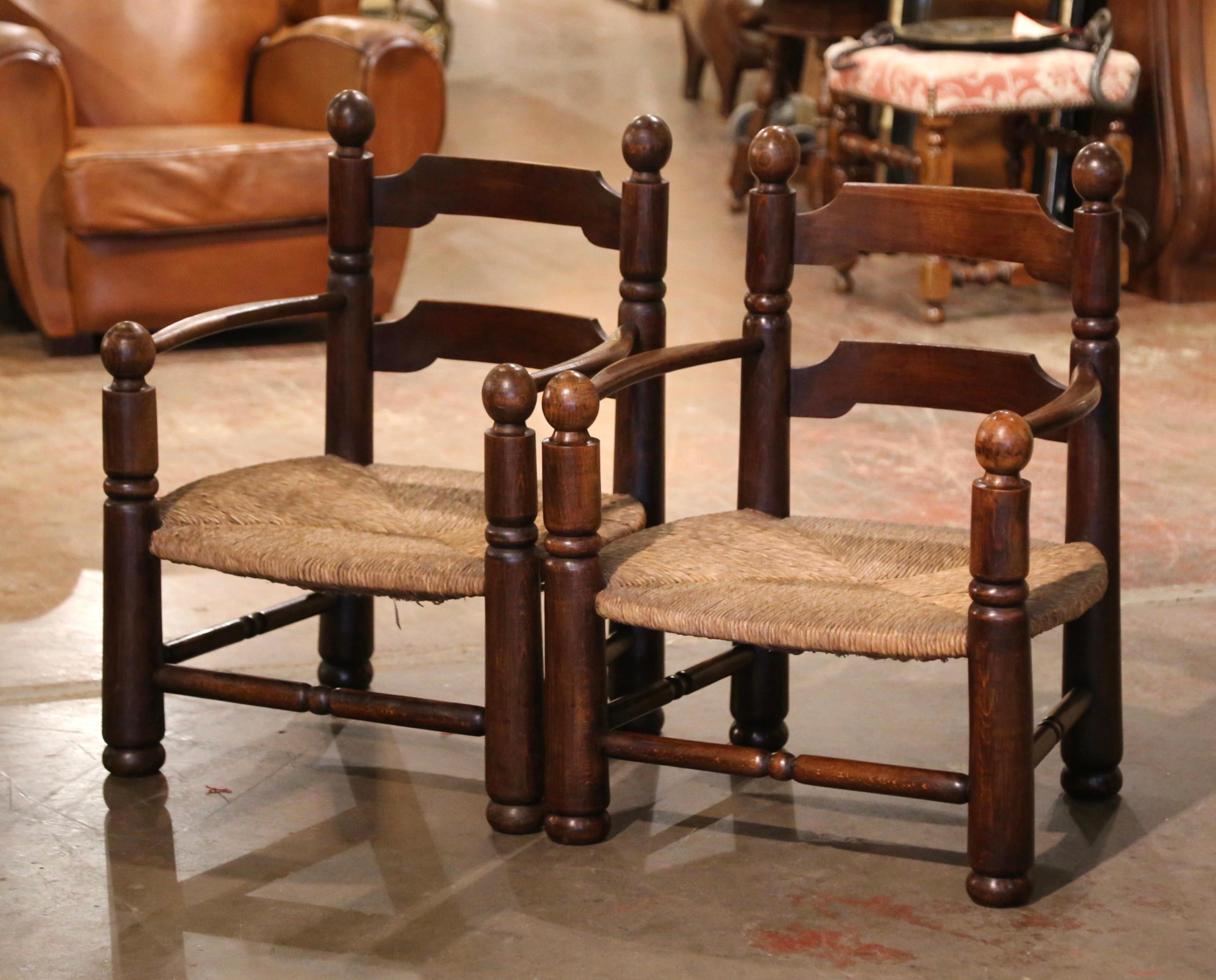 Pair of Early 20th Century French Carved Oak, Rush Seat Fireplace Low Armchairs In Excellent Condition In Dallas, TX