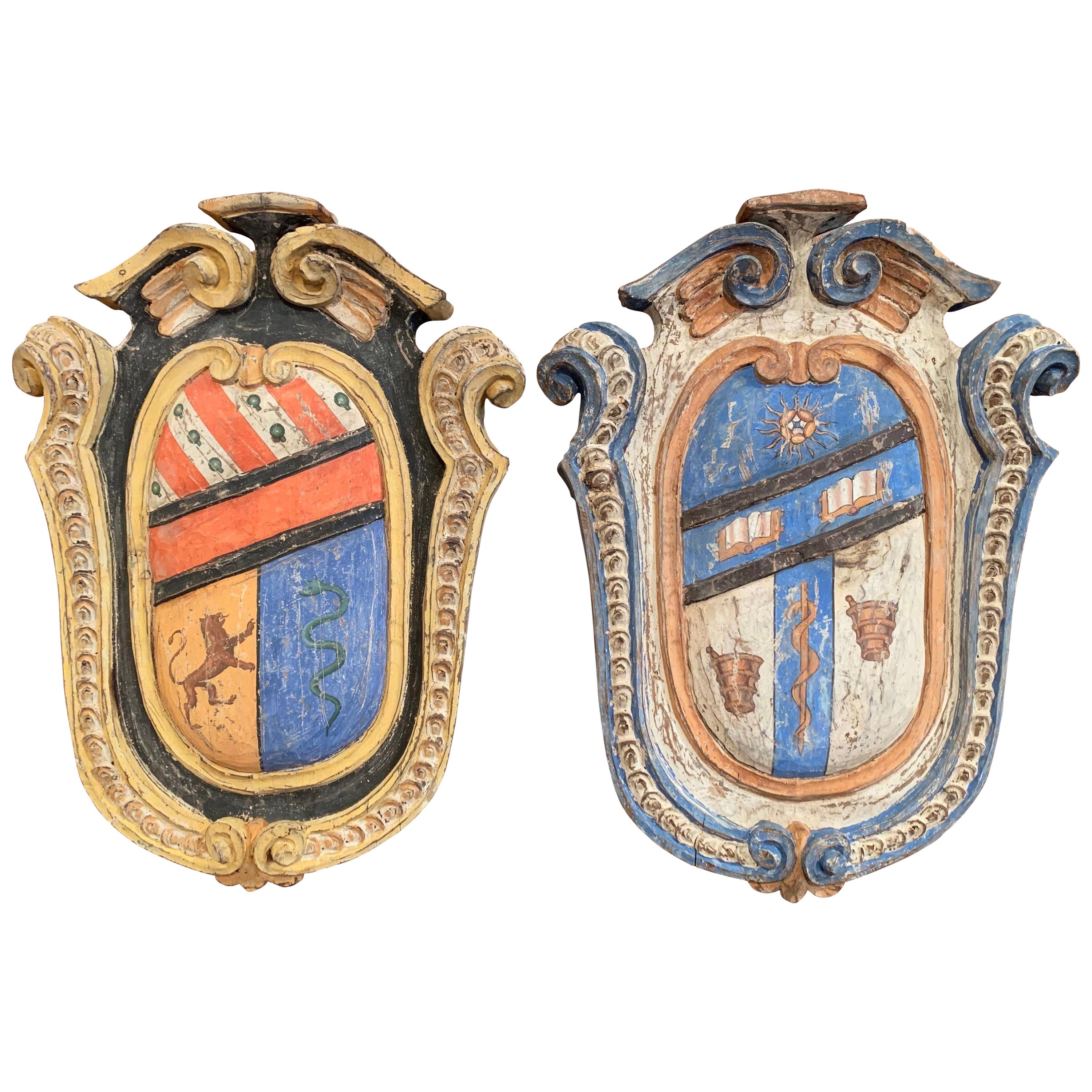 Pair of Early 20th Century French Carved Painted Wall Hanging Shields with Crest