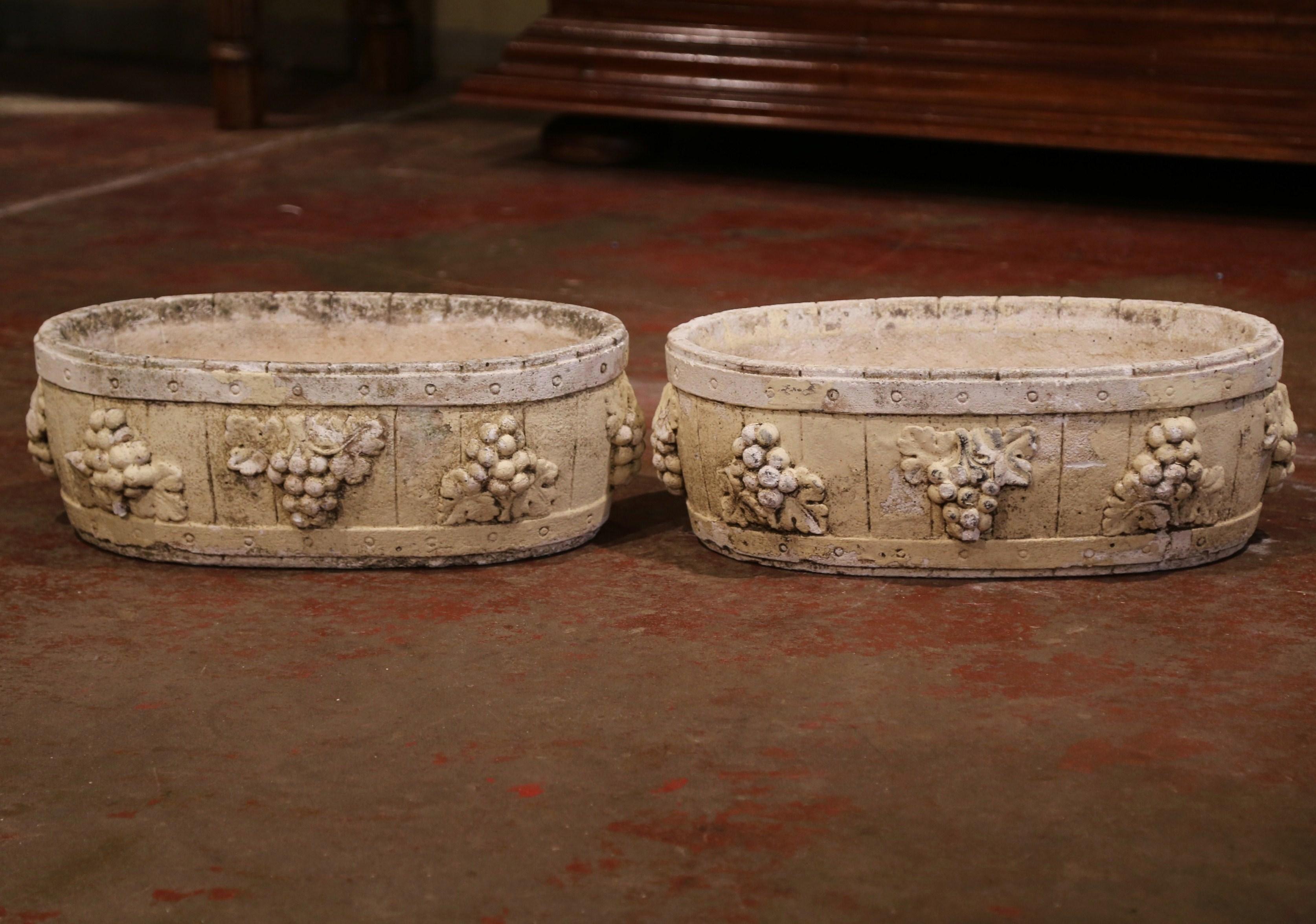 Patinated Pair of Early 20th Century French Carved Stone Planters with Grape Decor