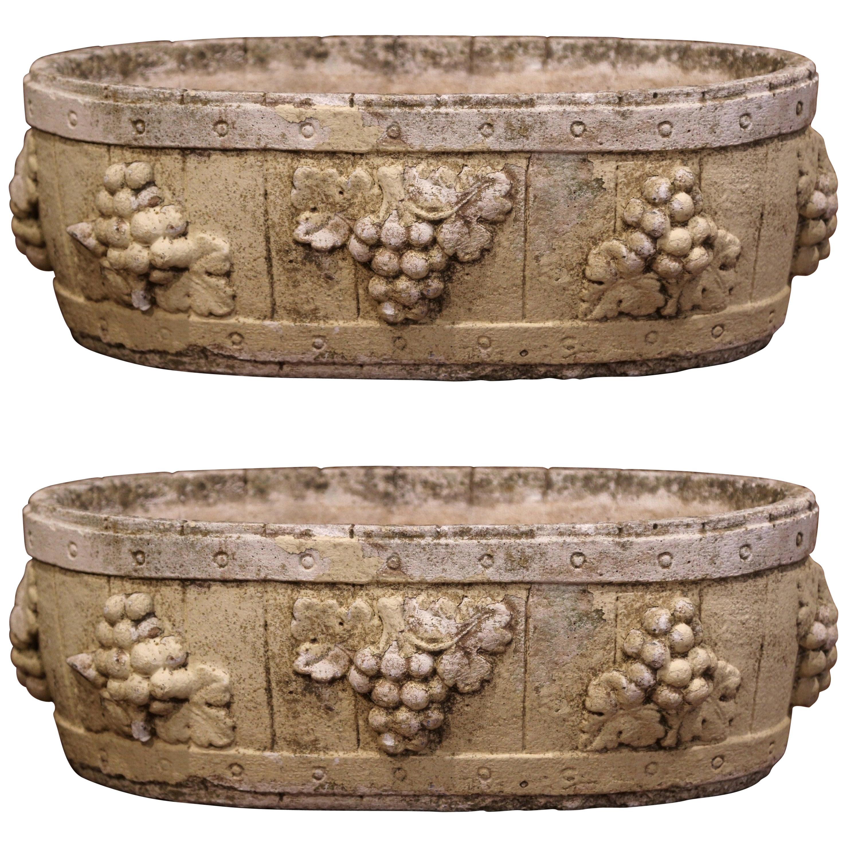 Pair of Early 20th Century French Carved Stone Planters with Grape Decor
