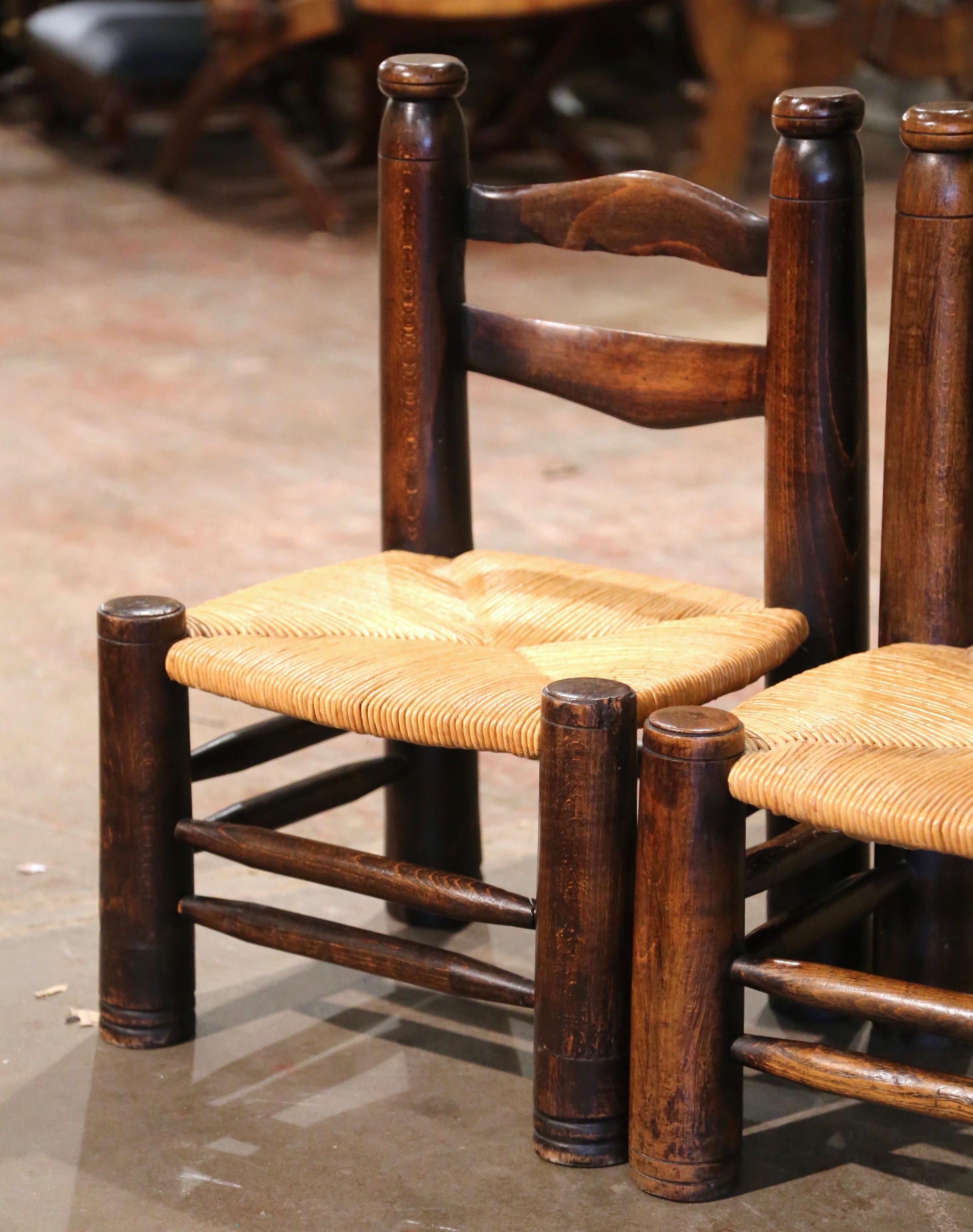 Country Pair of Early 20th Century French Carved Walnut and Rush Seat Low Chairs For Sale