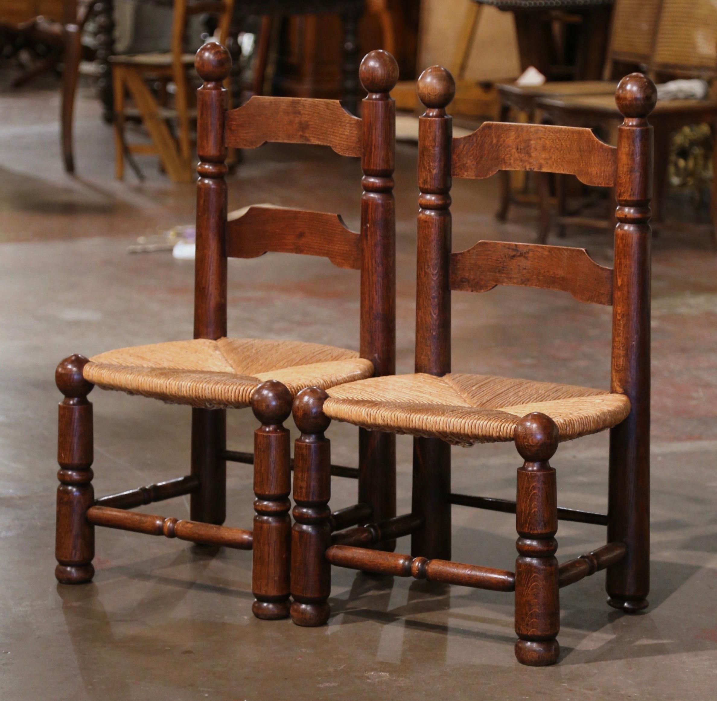 Hand-Carved Pair of Early 20th Century French Carved Walnut and Rush Seat Low Chairs