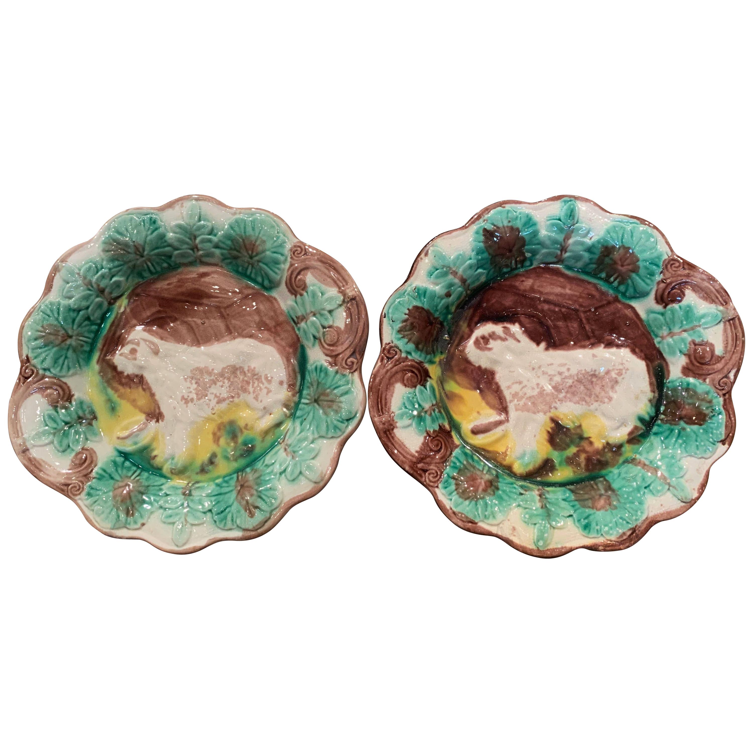 Pair of Early 20th Century French Faience Barbotine Wall Plates with Dog Figures