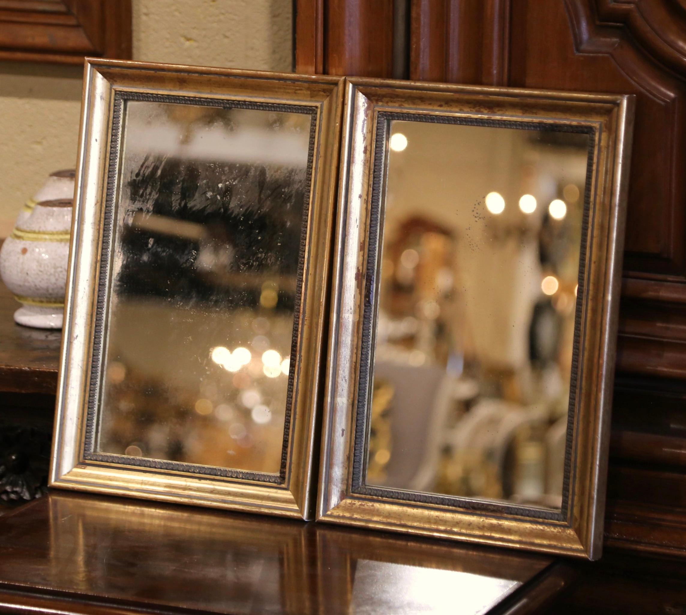 Decorate a hallway or entry with these matching gilt wood wall decors. Created in France circa 1920, each carved frame with Classic lines, features a beautiful gold leaf finish and is dressed with the original mercury glass. Versatile, they could