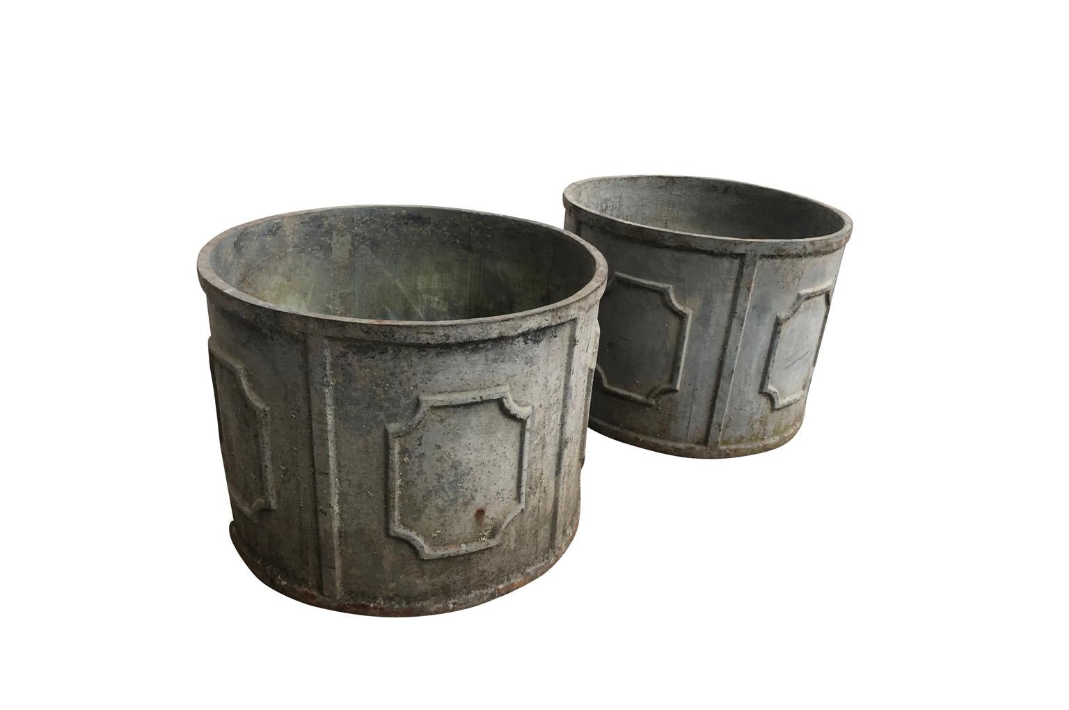 A very handsome pair of early 20th century jardinières from the South of France. Wonderfully constructed from patinated cast iron. Beautiful for any garden or interior.