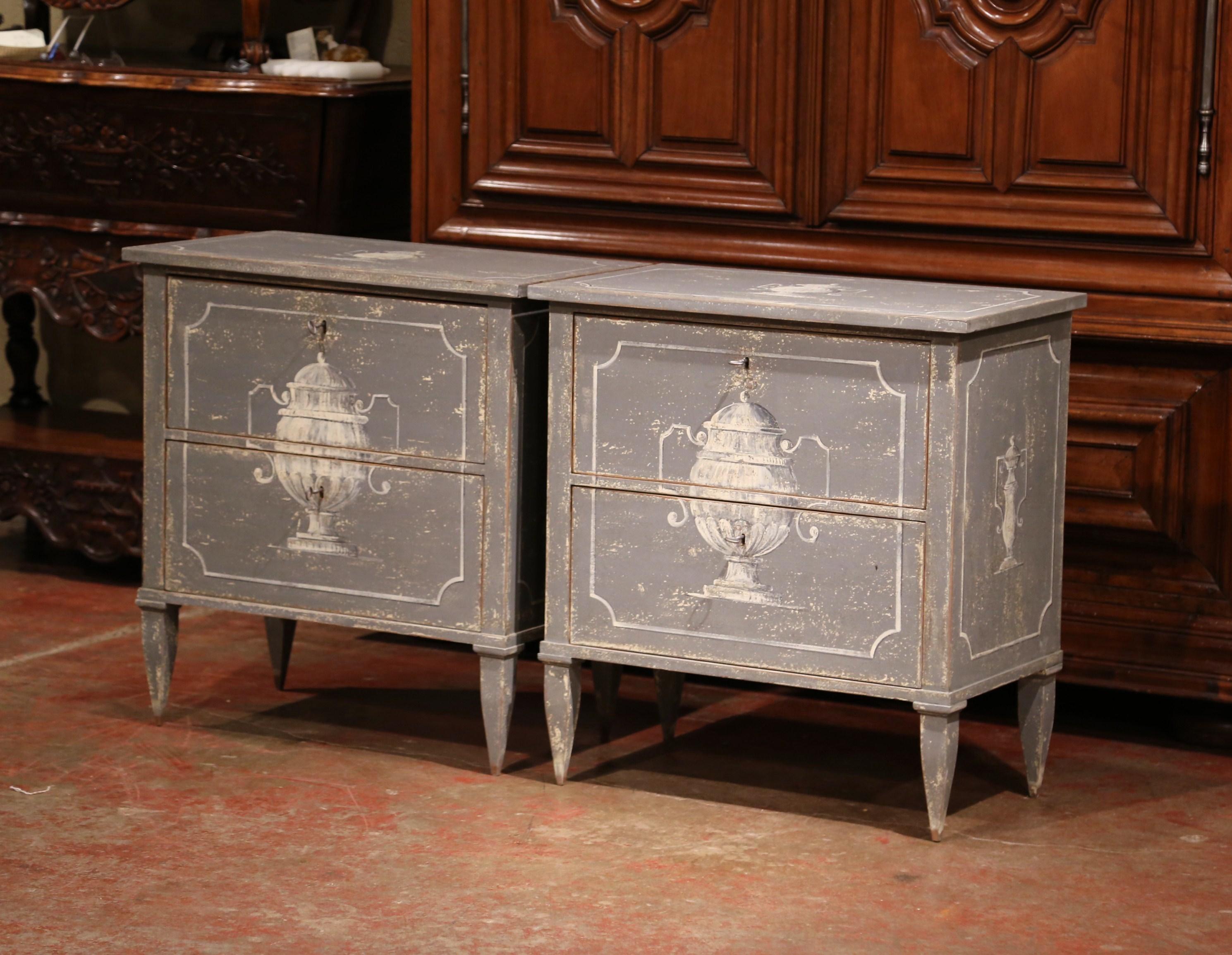 Place these rustic, antique bedside tables on each side of a king size bed. Crafted in northern France circa 1920, each chest sits on four tapered legs and has two drawers across the front. Both of the wide, deep commodes are hand painted in a