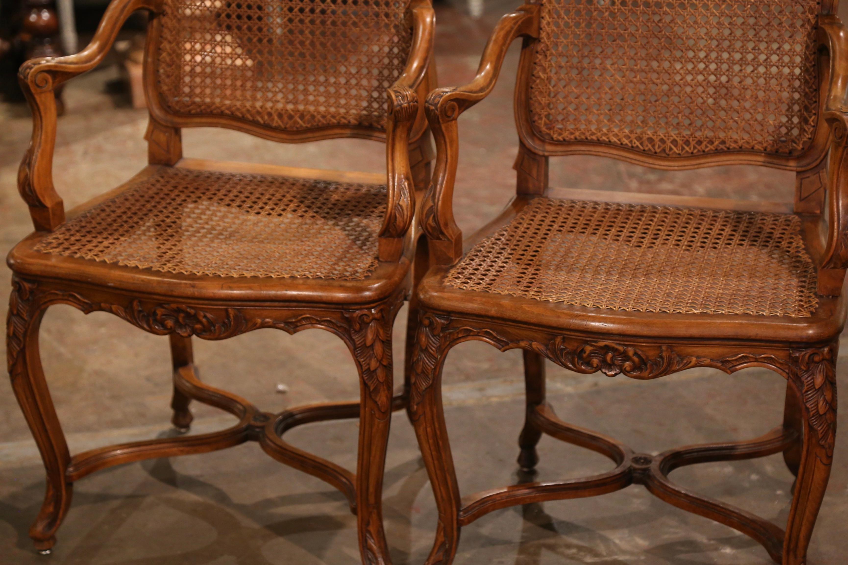 Hand-Carved Pair of Early 20th Century French Louis XV Carved Walnut and Cane Armchairs