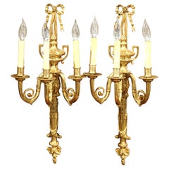 Pair of Early 20th Century French Louis XVI Bronze Dore Three-Light Wall Sconces