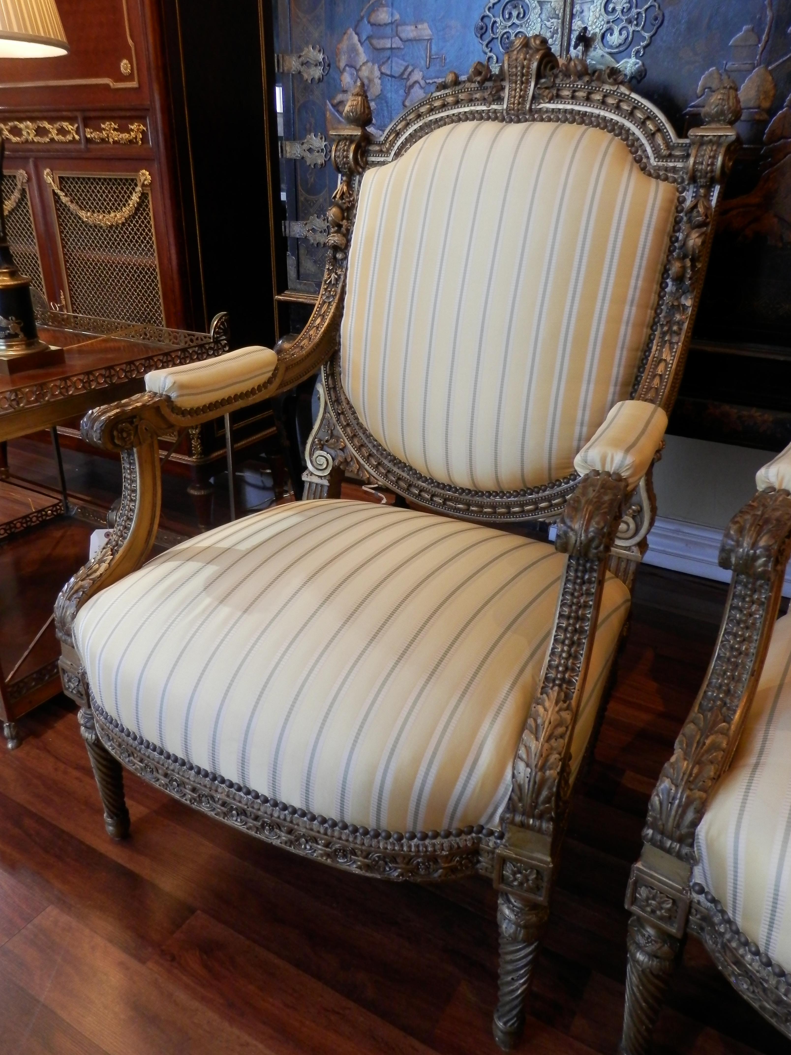 Beautiful pair of French Louis XVI gilt large open armchairs.