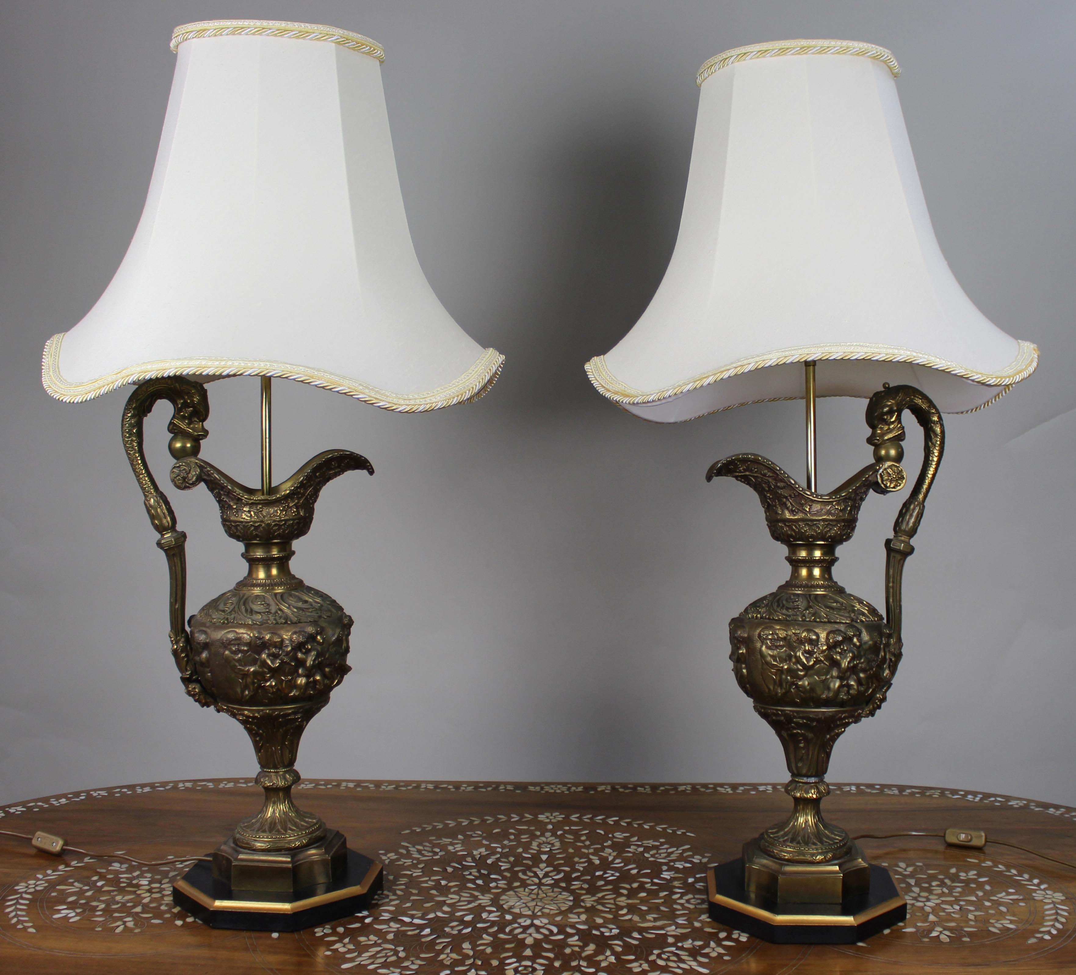 Pair of Early 20th Century French Neoclassical Ewer Lamps with Putti Relief

We are pleased to offer a striking and impressive finely detailed pair of early 20th century French table lamps, modelled after classical ewers and later professionally