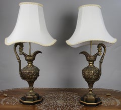 Pair of Early 20th Century French Neoclassical Ewer Lamps with Putti Relief