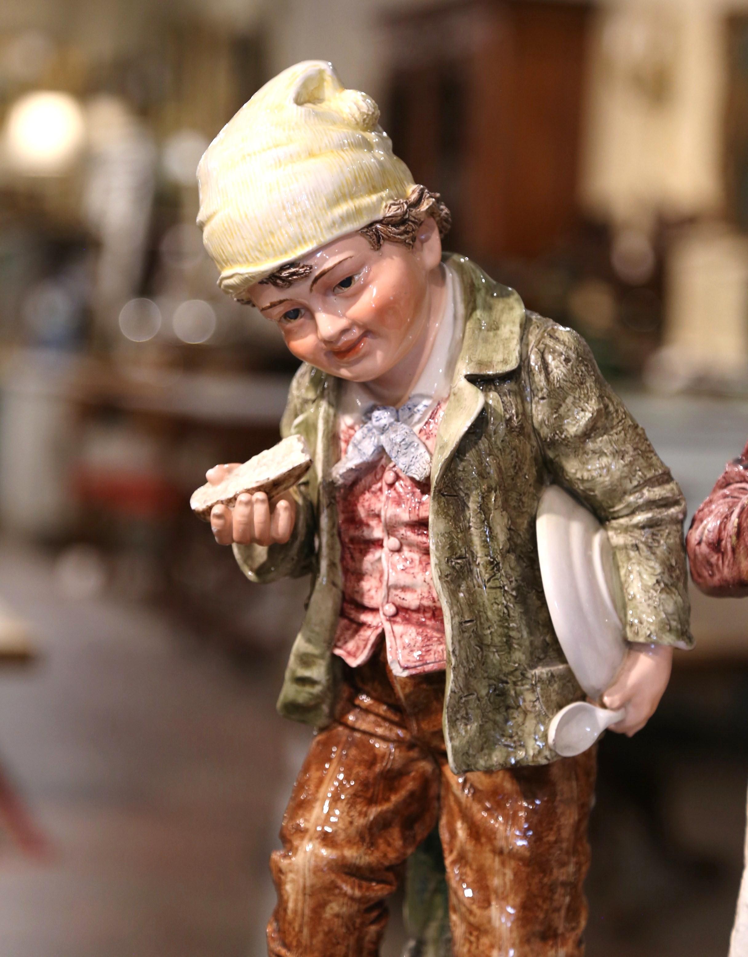 Hand-Crafted Pair of Early 20th Century French Painted Porcelain Barbotine Children Figurines