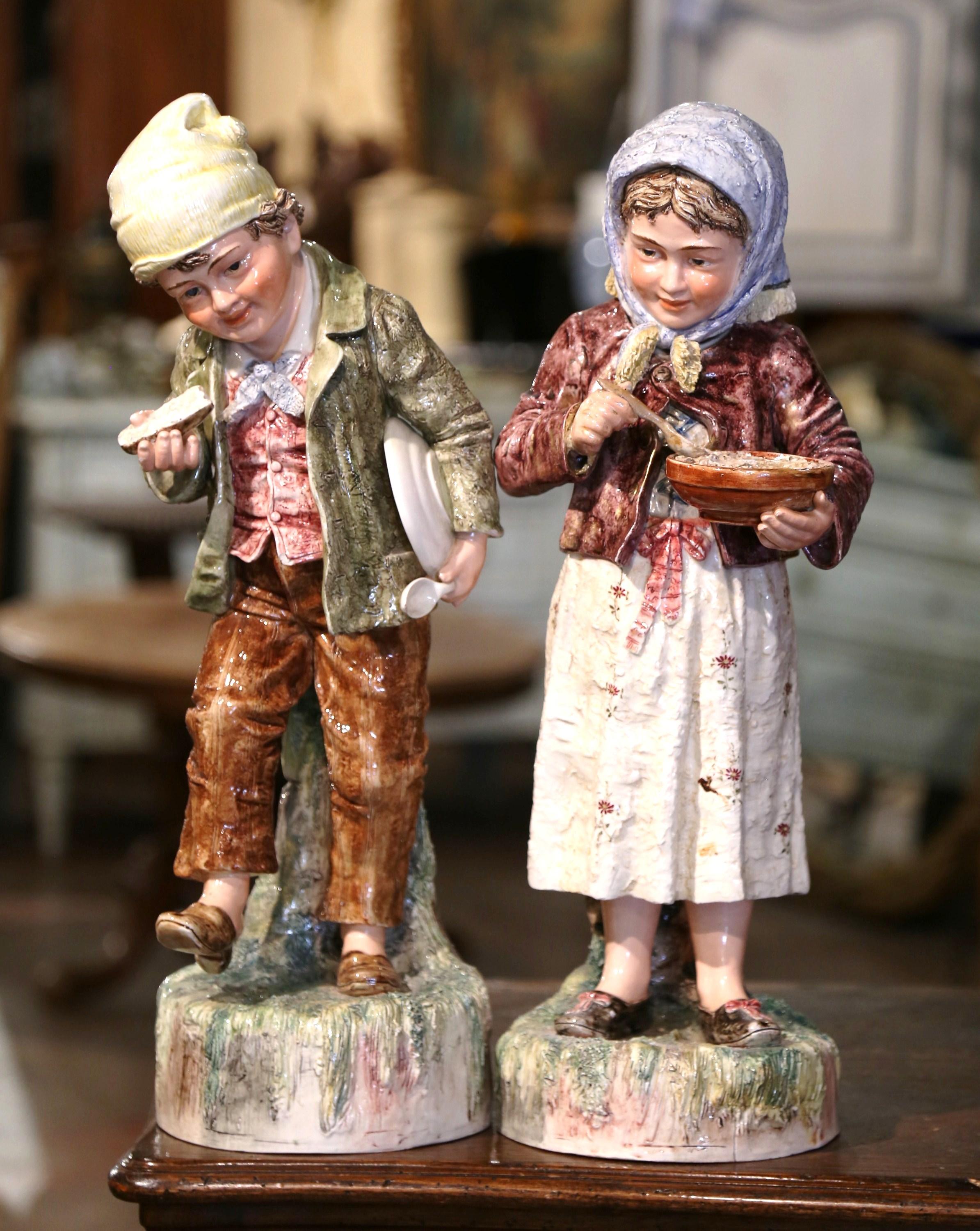 Pair of Early 20th Century French Painted Porcelain Barbotine Children Figurines 1