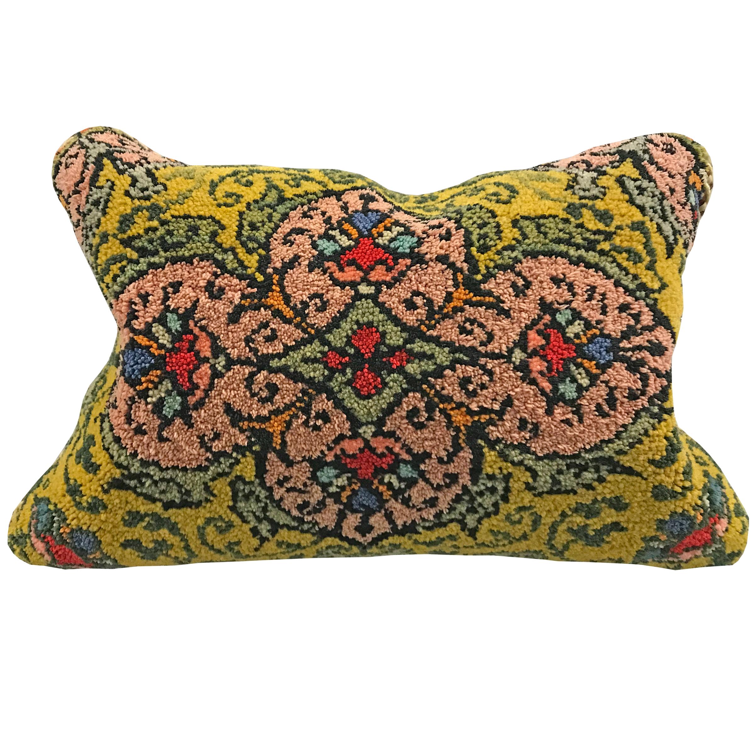 A pair of pillows made from early 20th century Hungarian finely executed hook rug Folk Art panels, backed with wool, and filled with down.