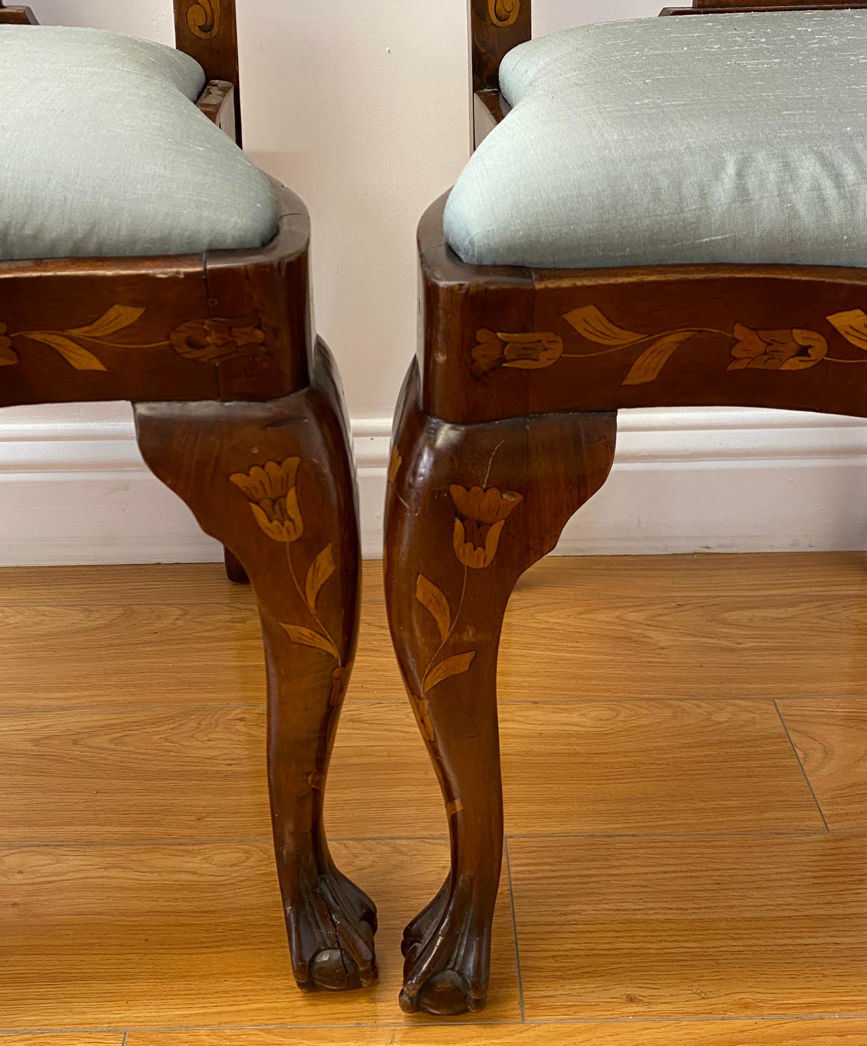Pair of early 20th century inlaid chippendale style side chairs

Outstanding inlay work featuring floral and fauna motifs on all sides

The frames are carved with Chippendale ball and claw feet

one of the feet shows a split in the wood - This