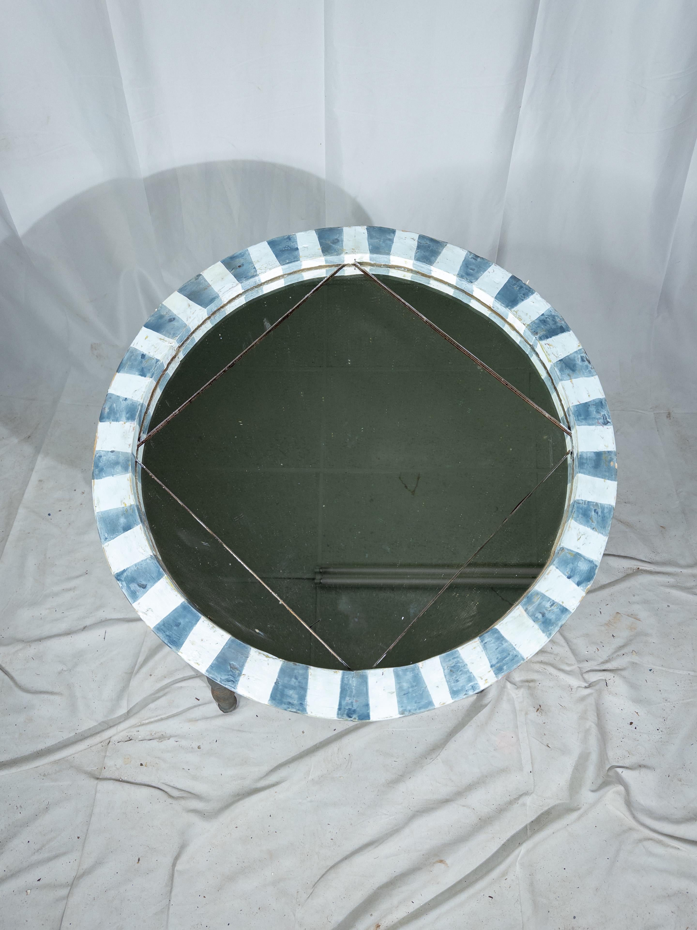 These early 20th-century Italian blue mirrors are a captivating blend of artistry and elegance, evoking the timeless allure of Italian craftsmanship. Each mirror features a round silhouette, adorned with an enchanting etched square at the center of
