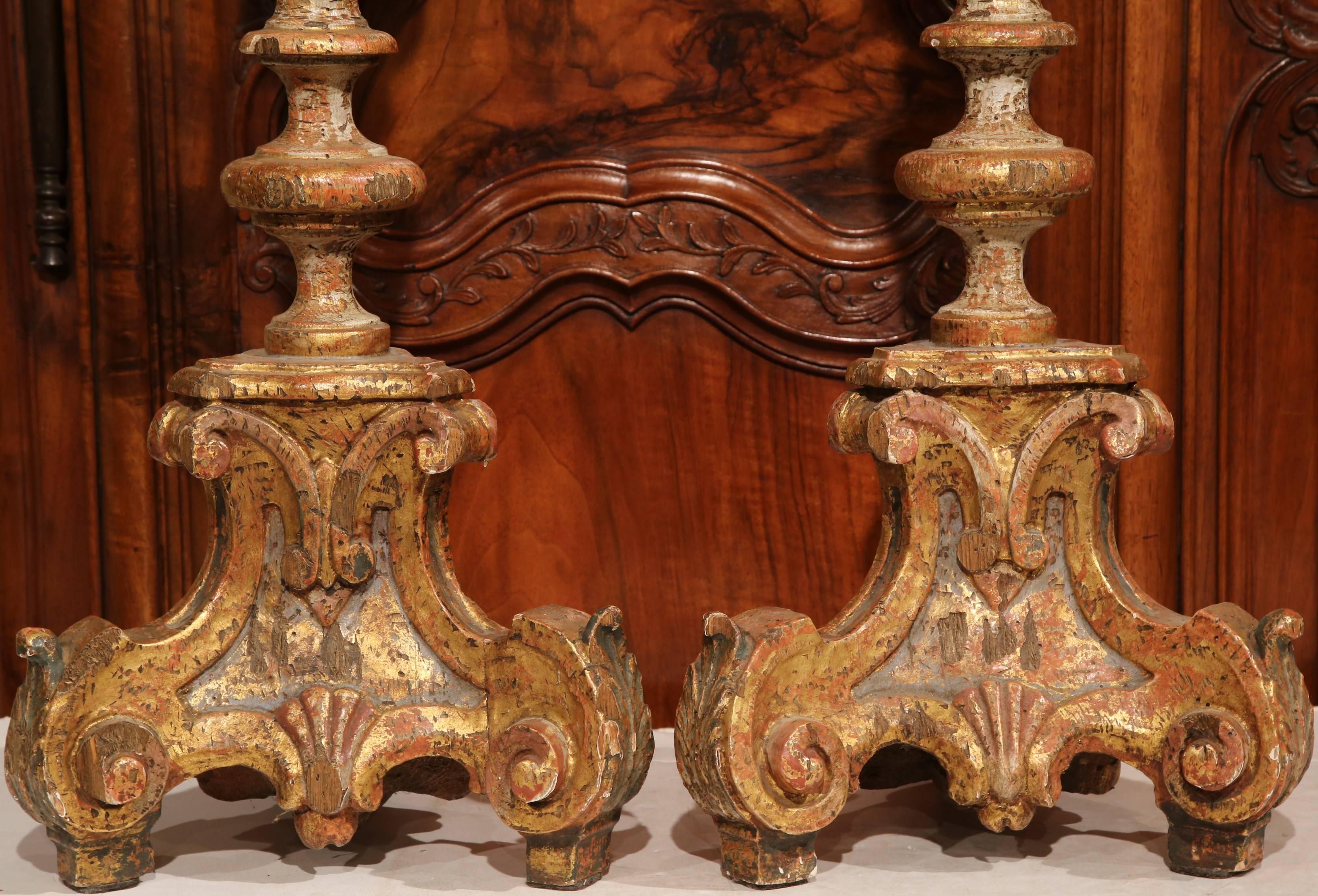 Place these tall antique candlesticks on your mantel, dining room or buffet. Crafted in Italy, circa 1920, the Baroque, Louis XV candleholders sit on three small feet; they have an ornate, sculpted shape and elegant two-tone painted combination of