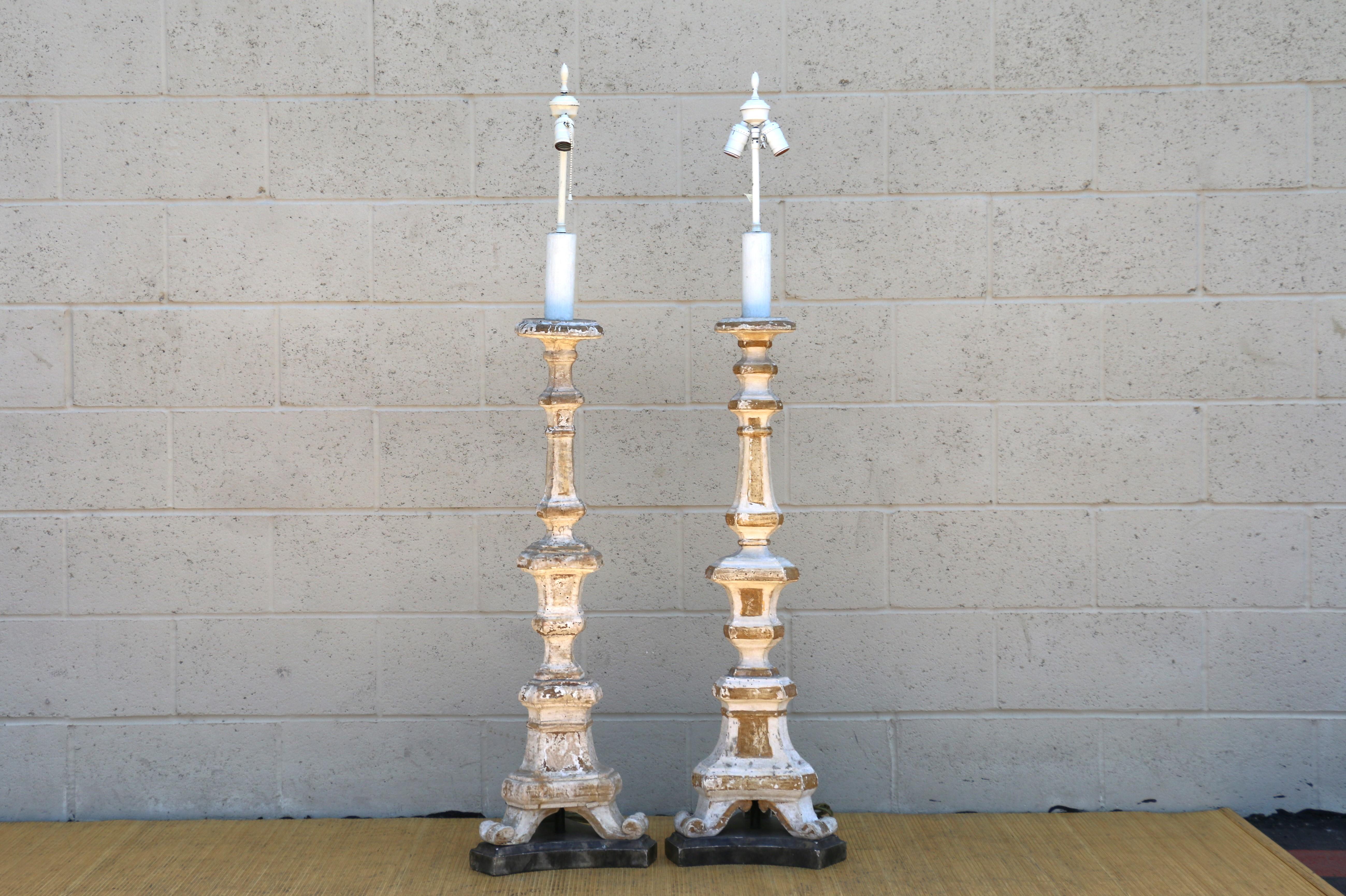 Beautiful pair of Early 20th Century Neoclassical Floor Lamps made in Italian, they are hand-Carved Giltwood. They are in good condition. Very good quality lamps.