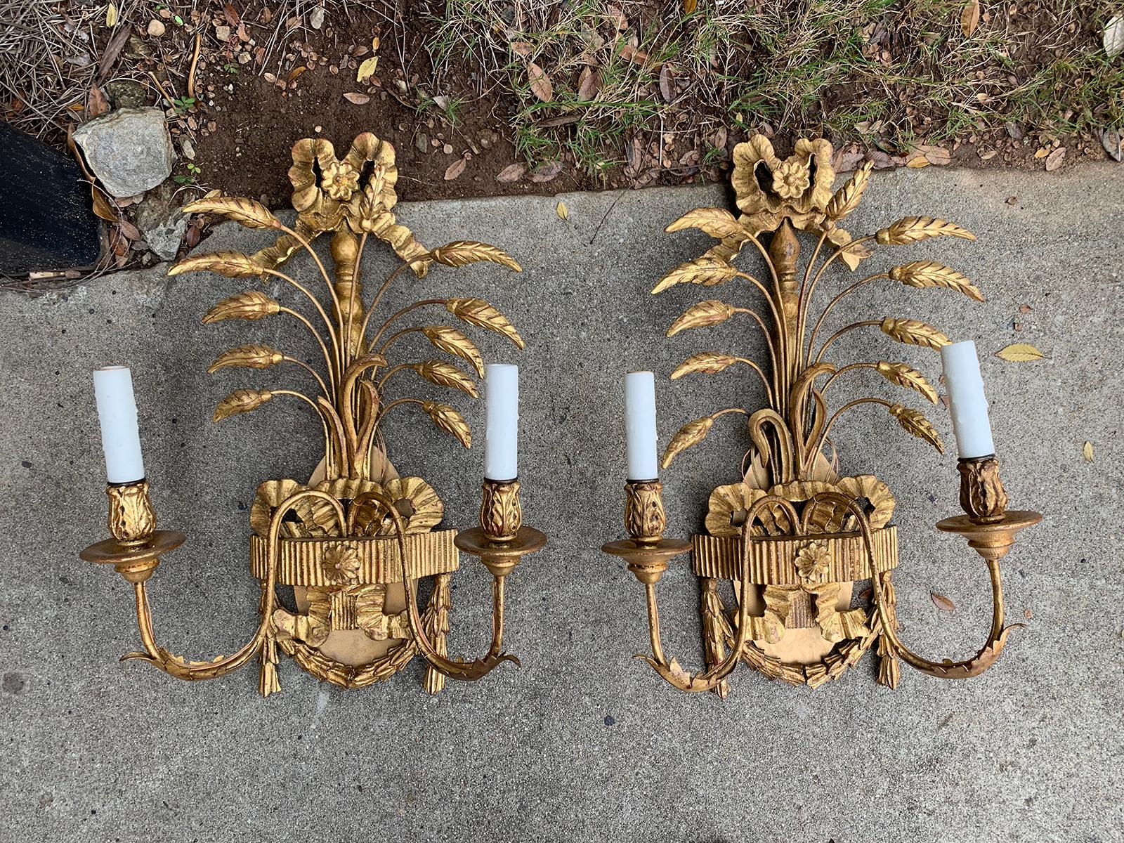 Pair of early 20th century Italian style giltwood two-arm sconces with wheat & ribbon detail, possibly Caldwell
New wiring.
