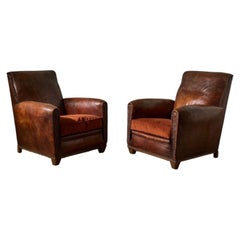 Pair of early 20th century leather club chairs