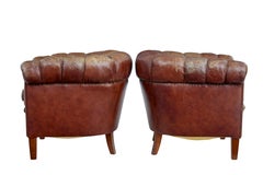 Pair of early 20th century leather lounge armchairs