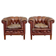 Pair of early 20th century leather lounge armchairs