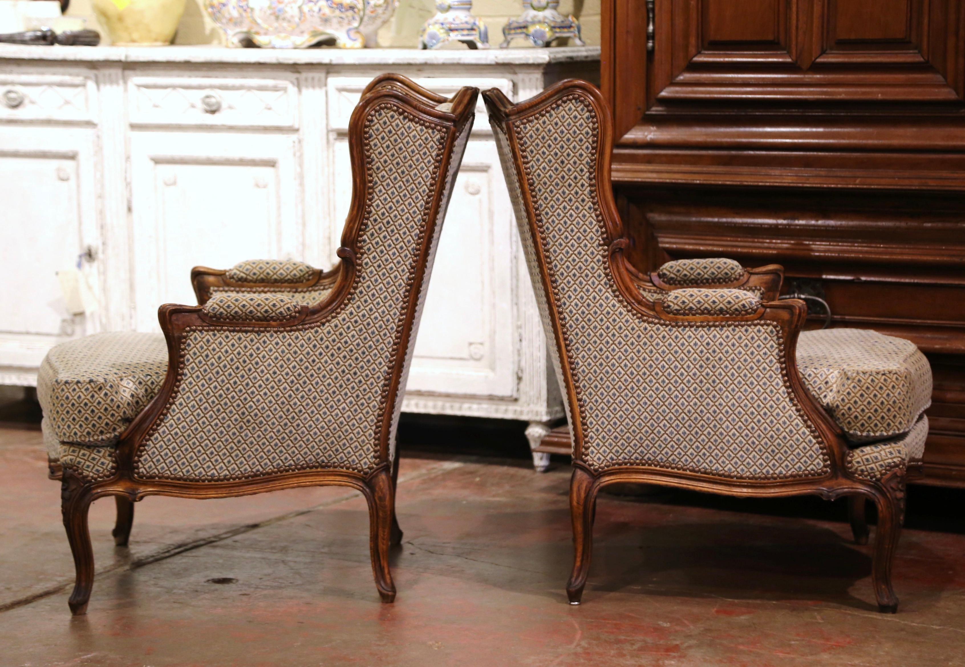 Fabric Pair of Early 20th Century Louis XV Provencal Carved Walnut Wing Back Bergeres